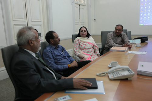 The delegation in discussion with Prof Mohandas Menon (left).