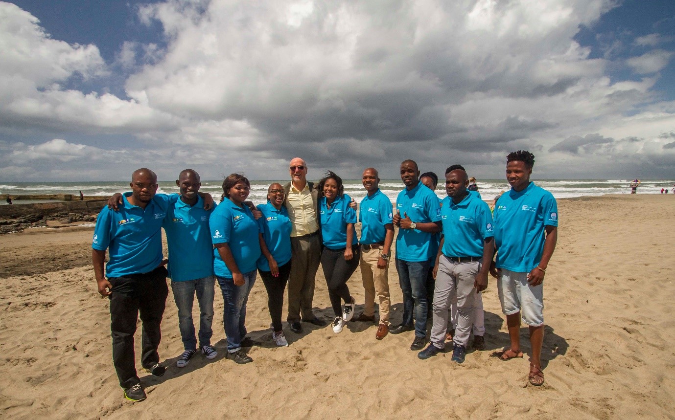 Figure SEQ Figure \* ARABIC 3 : Minister of Tourism (Centre) with Stewards from the Tourism Blue Flag Project (clothed in blue shirts)