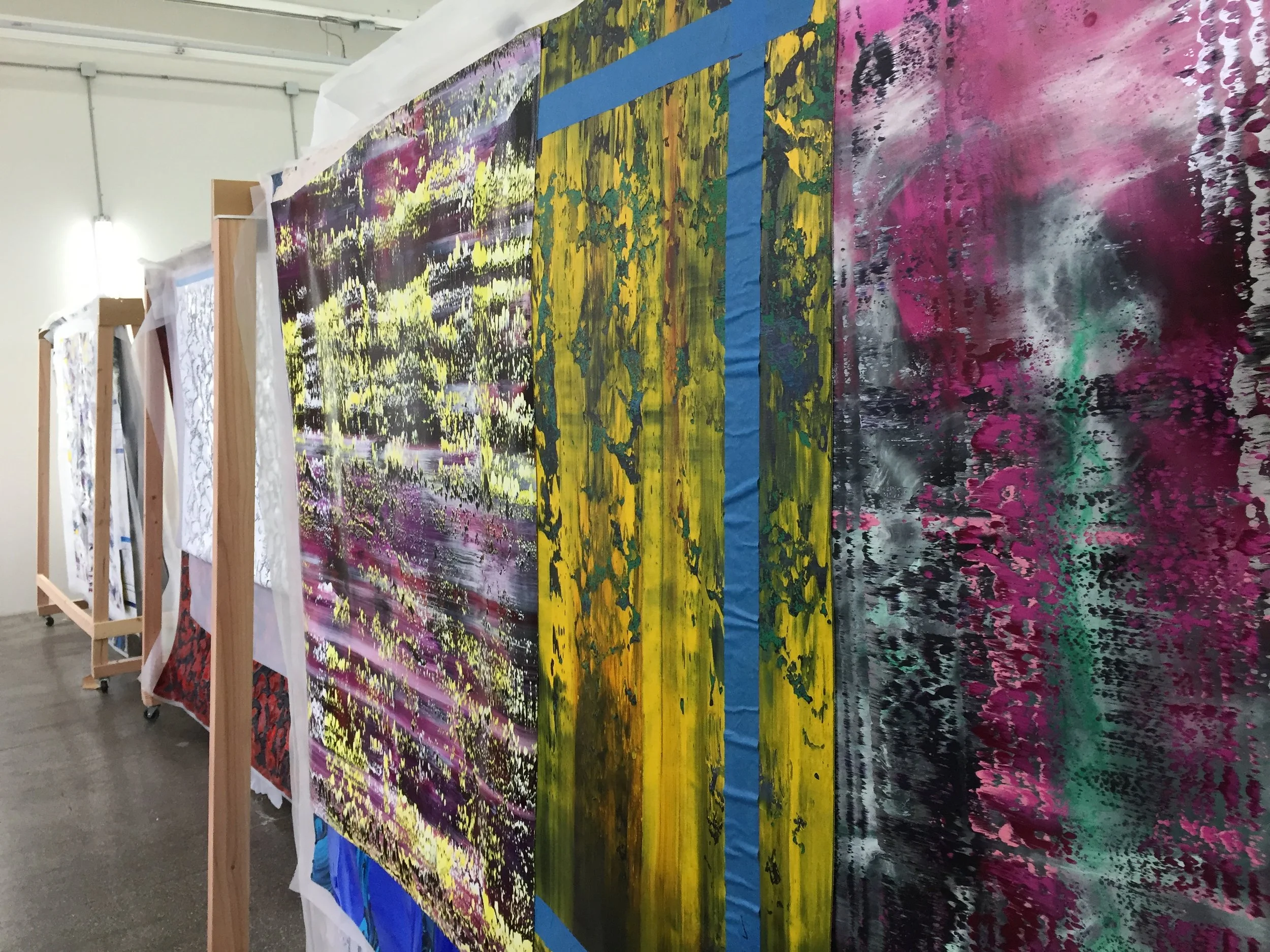  Paintings were hung on custom-made stands to ensure their preservation before being incorporated into the designs. 