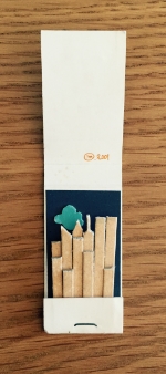 a matchbook from, Obeca Li, another restaurant around the corner from the Odeon, transformed into New York City's skyline at the time