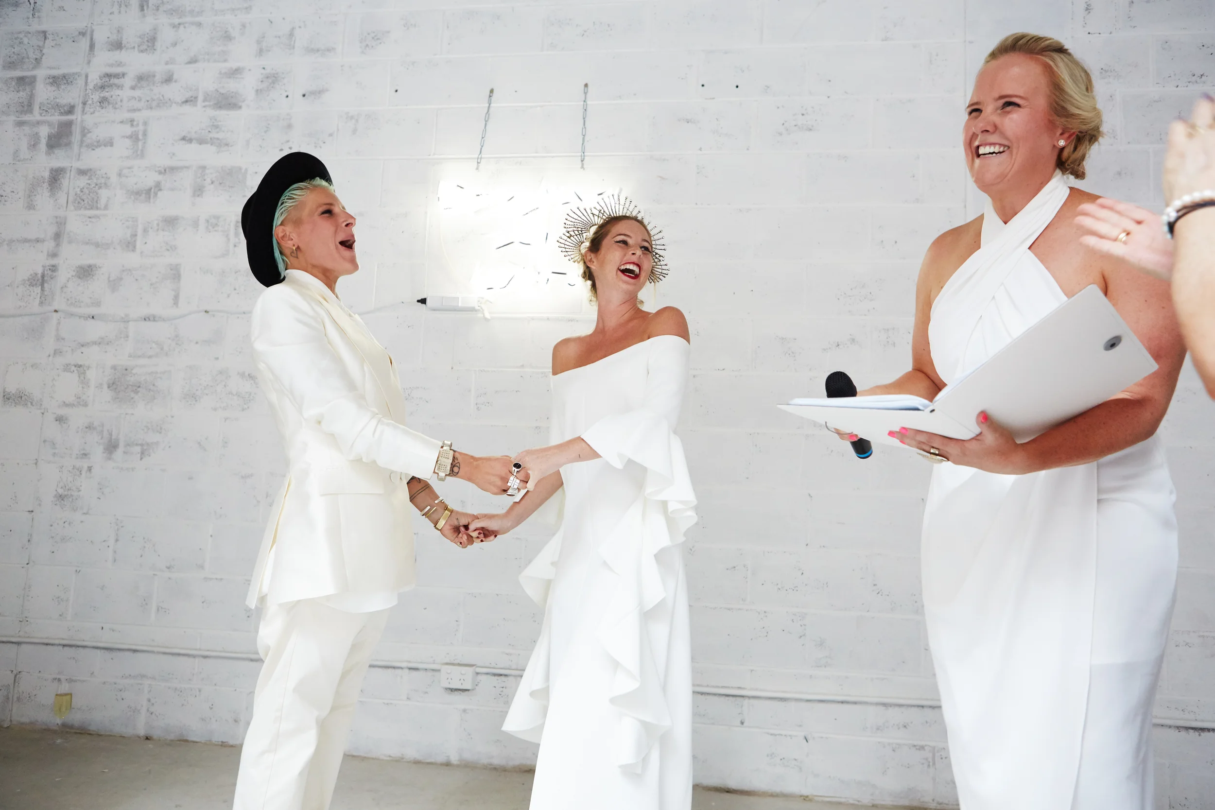 Lauren has the perfect balance of professionalism, integrity and heart. She places time, care and unlimited support in helping to create a unique and indeed memorable wedding. During the lead up and of course on what was honestly the most incredible day of our lives, she had everything covered from tissues for tears, to smiles, laughs and crowd warming welcomes. Lauren understands that the bond between two souls and their love shared is the most important factor. Having someone who treated our day with all of the integrity that a wedding should, even in the face of a government that does not treat us with equality, made all the difference. Our wedding was that and so much more, and purely because of the love and support that Lauren whole- heartedly placed in the ceremony. We cannot recommend her enough, having someone standing next to you that you can trust to help guide you when you are in the highest of emotional states is nothing less than the most valuable gift! We thank you with all that we are, for being such an integral part of our wedding. Love Lotte & Lia-Belle
