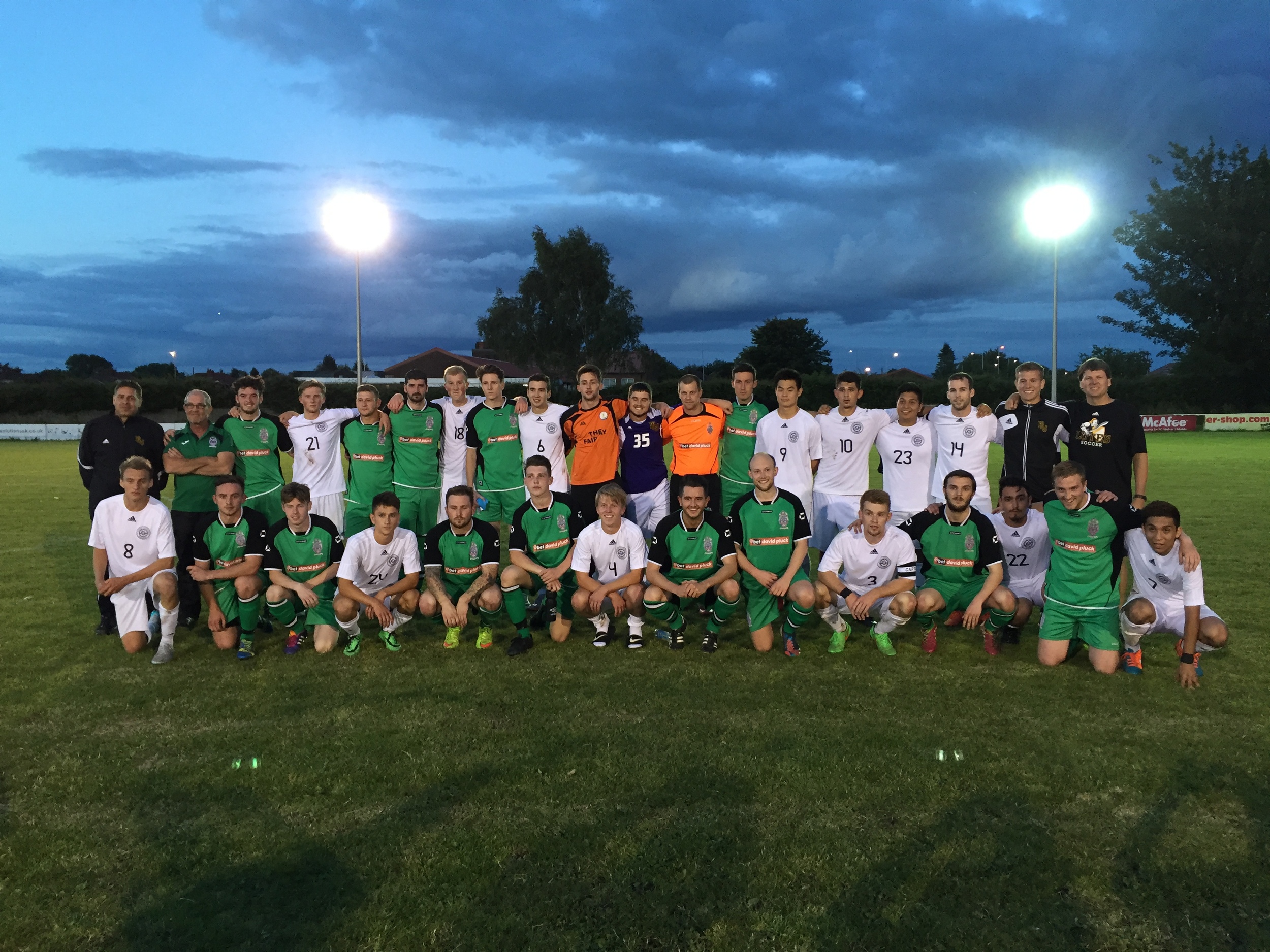 Both sides get together for a post-match photo