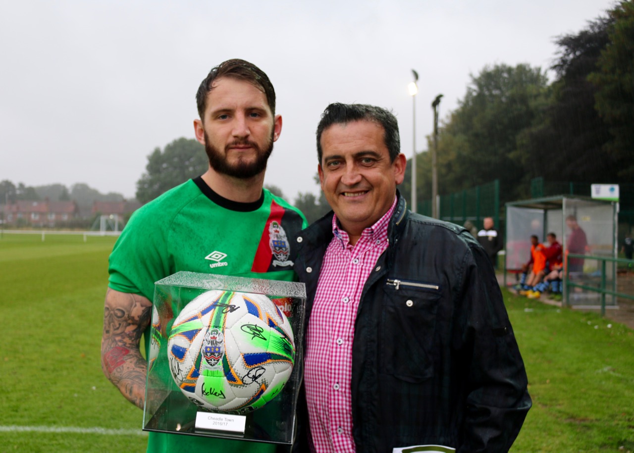 Alfie Hincks, Principle of Seascope, receiving a signed ball from club captain James Moore before the home match vs Litherland REMYCA