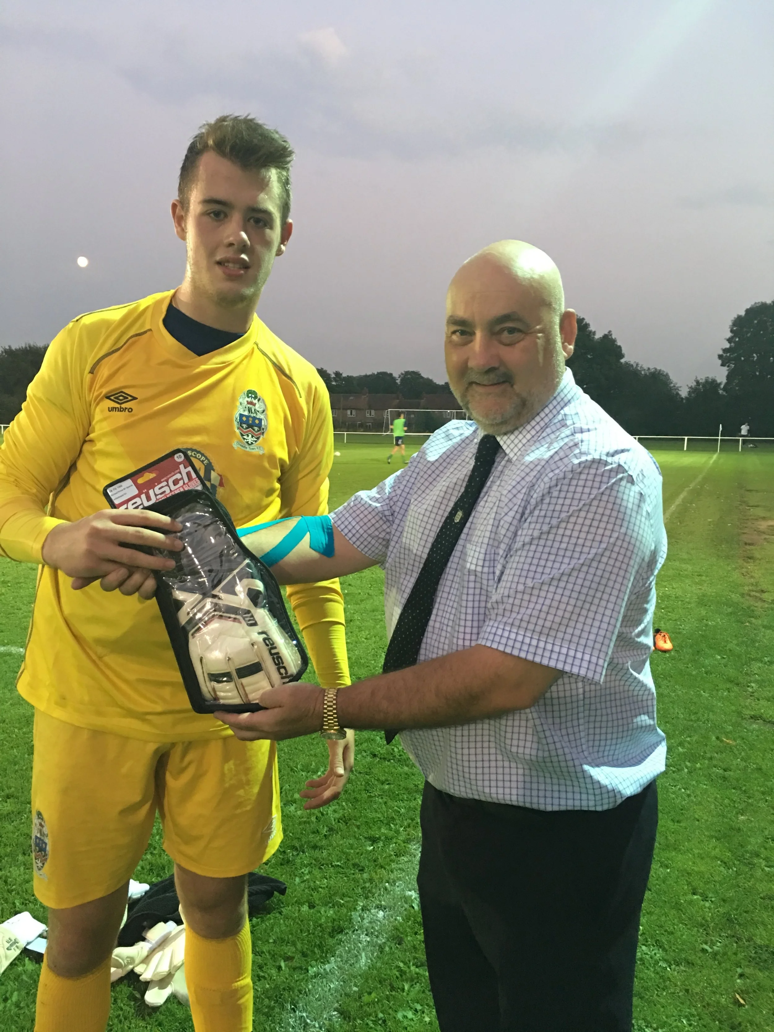 Ben Jupp receiving his Goalkeeper of the Month Award from the Hallmark Security League's Ian Williams before kick-off