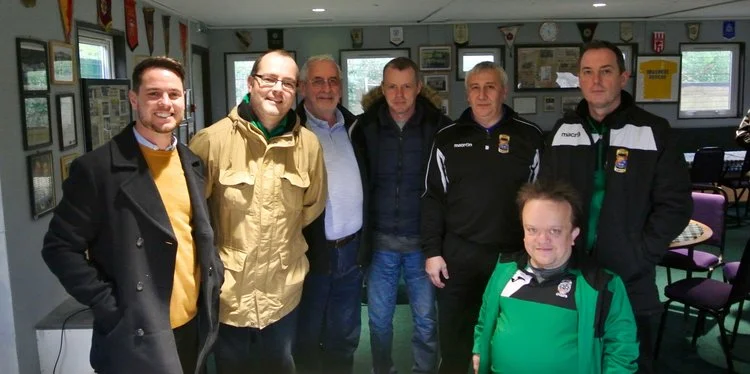 Craig Brennan (far left) with members of the committee after signing the deal on 30th December