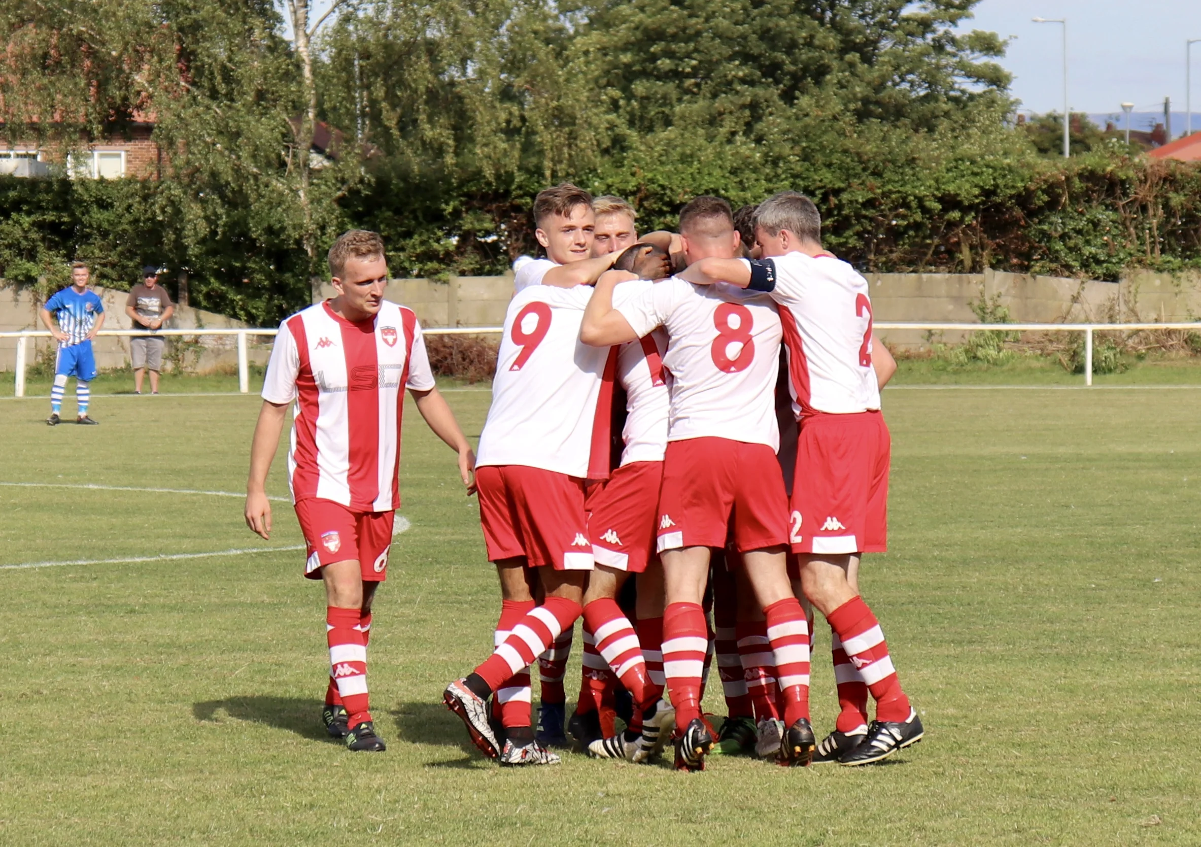 Somewhere in the middle of that huddle is Rhys Clooney