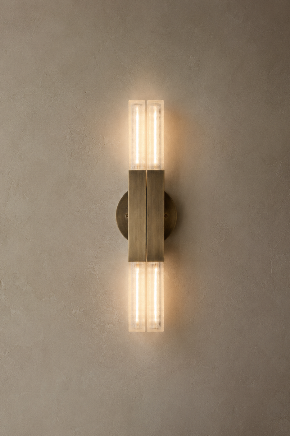 Daikon+Studio+KoKo+Sconce+Naval+Brass+on+Plaster+wall.png