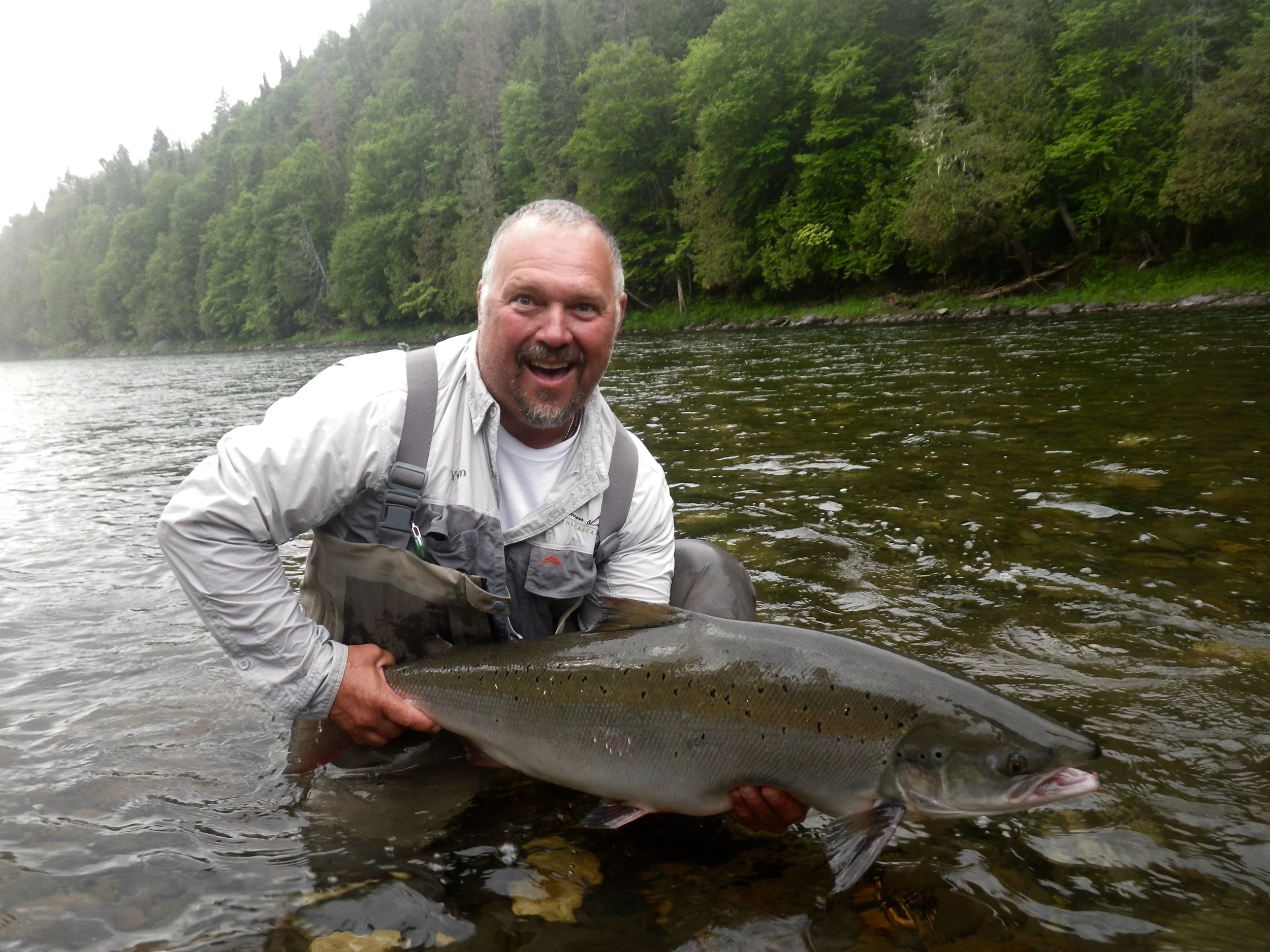 Salmon Lodge Guide Yvan Bernard puts a nice one back in the Grand Cascapedia. Yvan know where to find them and how to catch them!