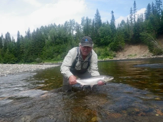 Jim Wicklund releases one back to the Grand Cascapedia, Nice fish Jim!