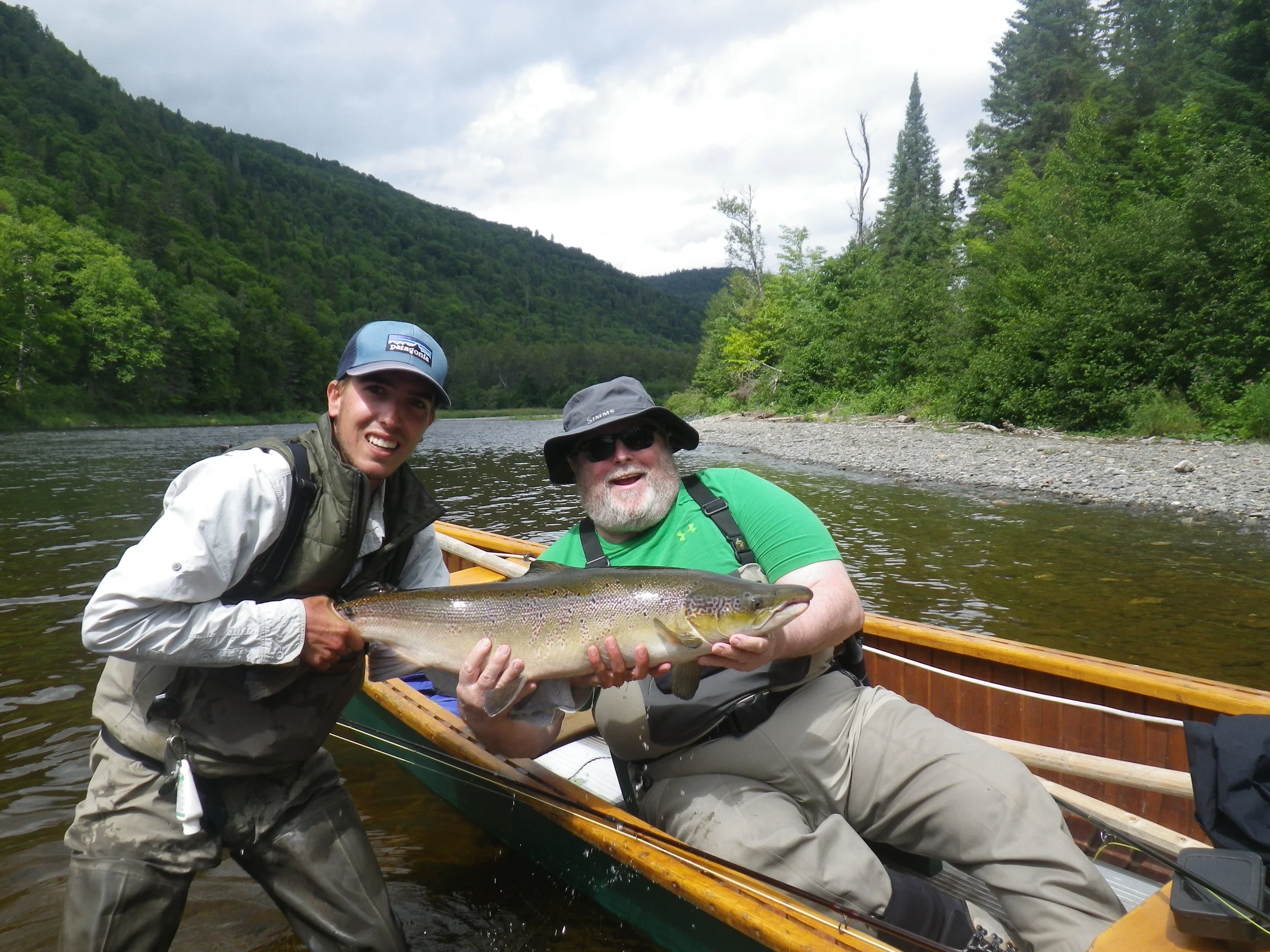 Julian Stoudemiere with Salmon Lodge guide Charles Binette on the Grand, Nice one Julian!!!
