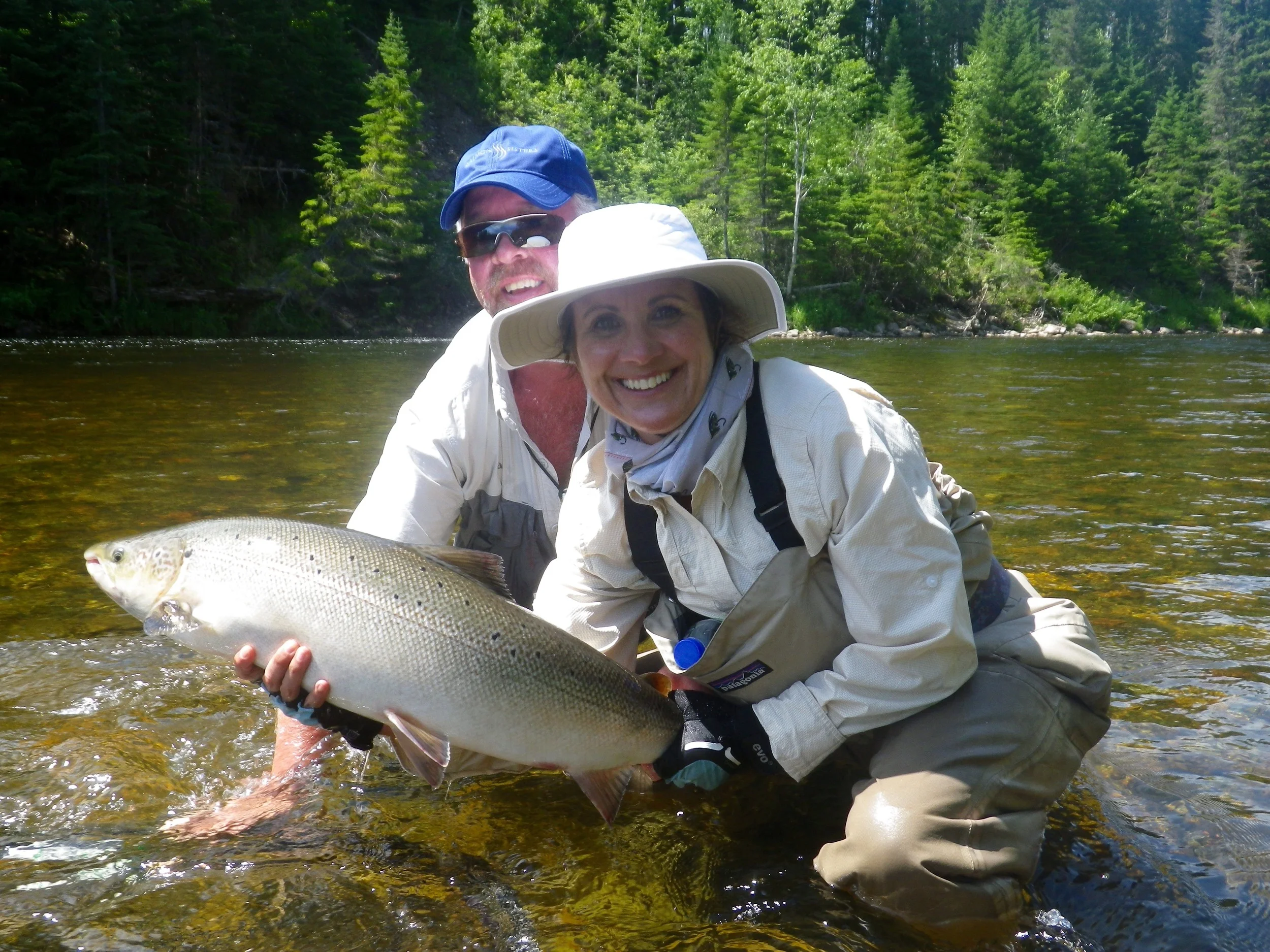 Kim Pilon lands her first Atlantic salmon with Salmon Lodge guide Larry Dee, Nice fish Kim!