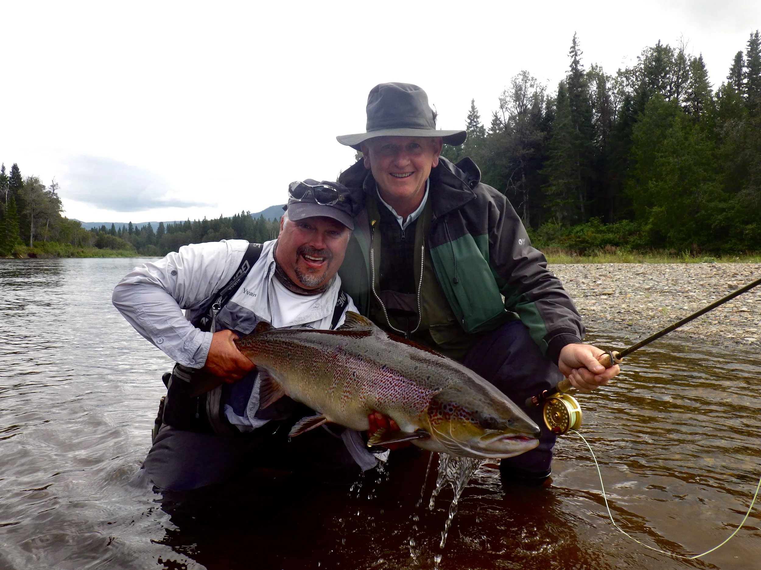 Salmon Lodge guide Yvan Bernard (left) and angler Stephen Coull with a big Grand Cascapedia Salmon. Congratulations Stephen!