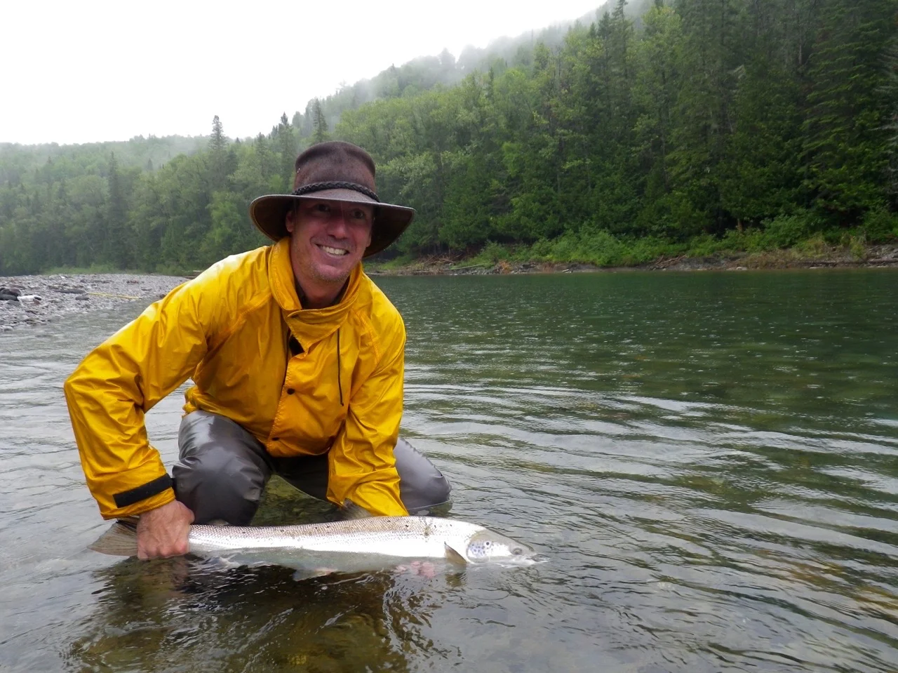 Louis Armand Bombardier releases a nice salmon back to swim again, Congratulations Louis Armand! Well done.