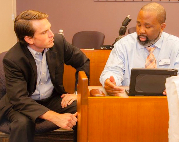 Institute volunteer (right) in discussions with Institute President W. Michael Short (left). (Photo Credit: EBV )