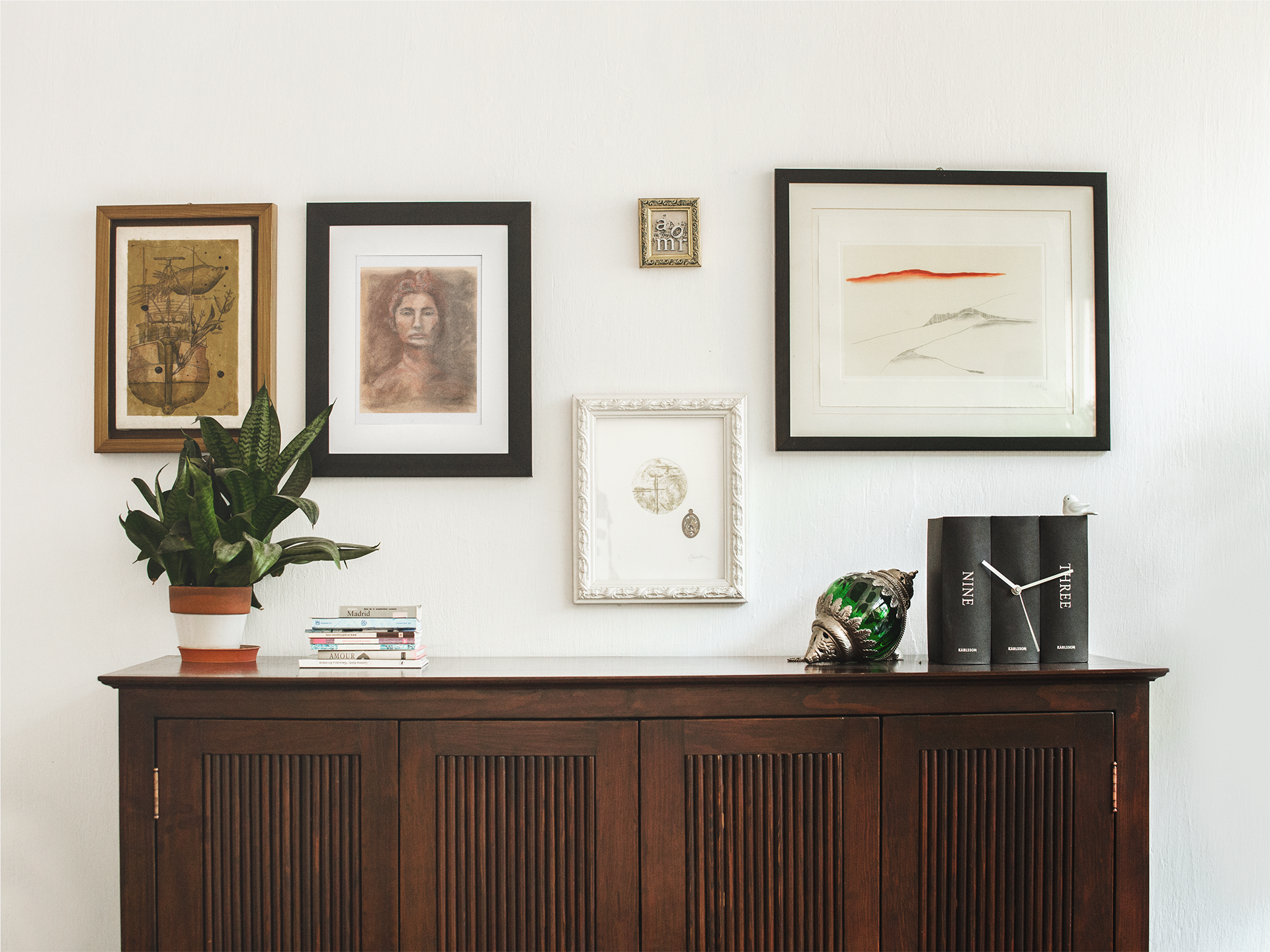 framed-art-print-template-on-a-white-wall-with-other-frames-a14772.png