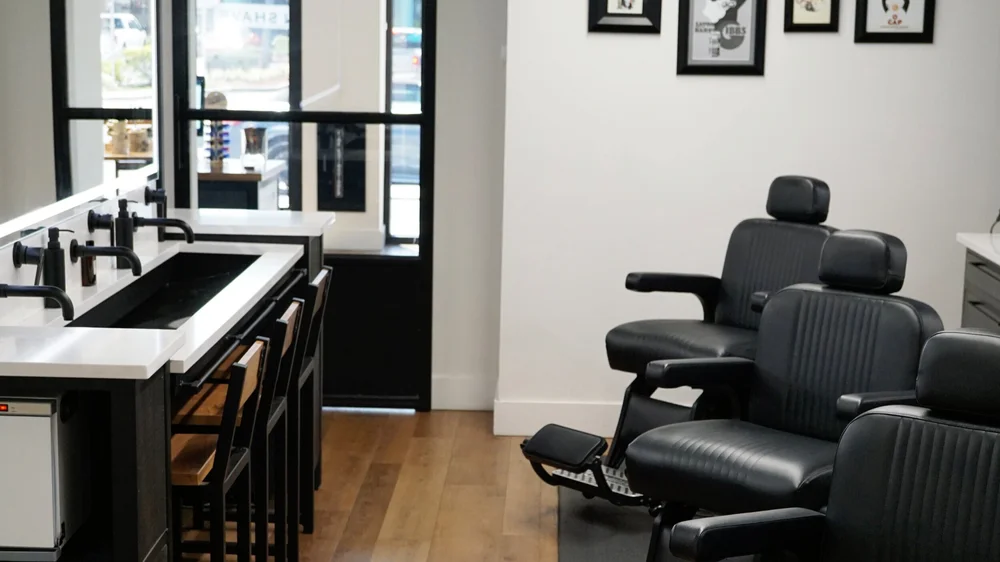 Barber chairs inside American Shave, a modern barber shop in Sarasota