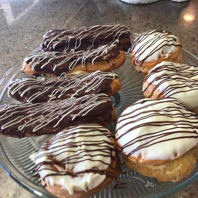 Vanilla bean pastry cream filled eclairs and cream puffs. #freshbakery #freshbaked #yummyfood #viptreatsandsweets #chocolategoodness #foodstagram #food #eatlocal #kauaigrinds #kauaifood #pastry #eclairs