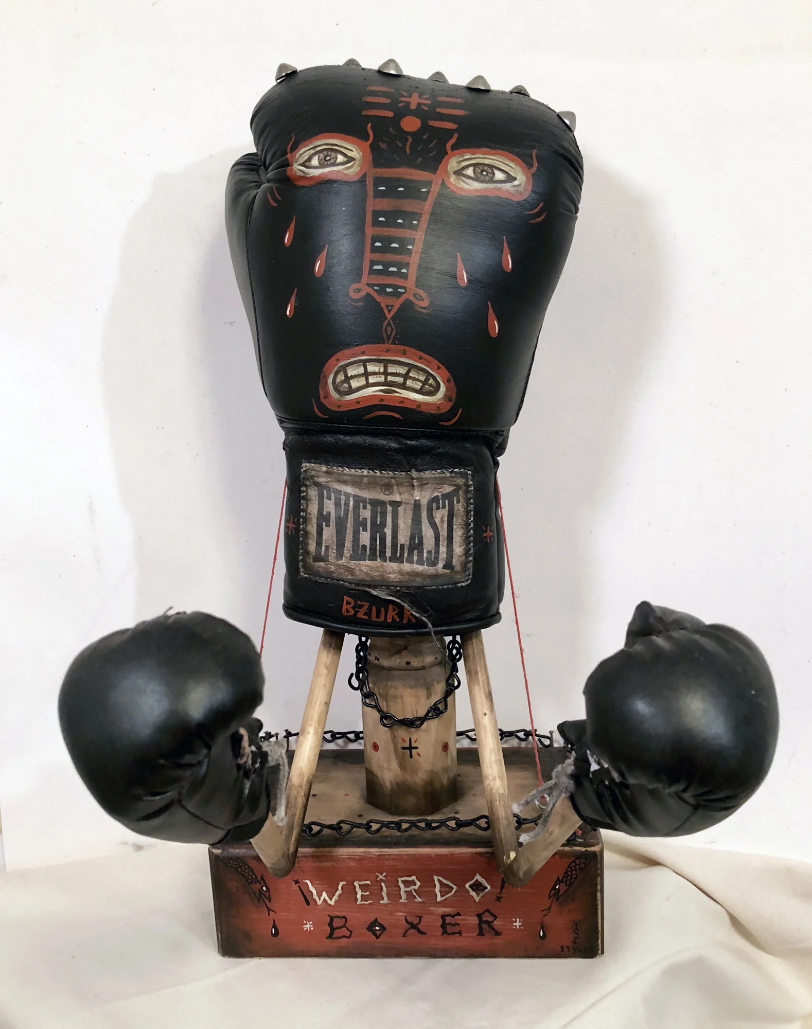 Weirdo Boxer, Acrylic on boxing glove, marionette arms, 19 x 15 x 9, $850