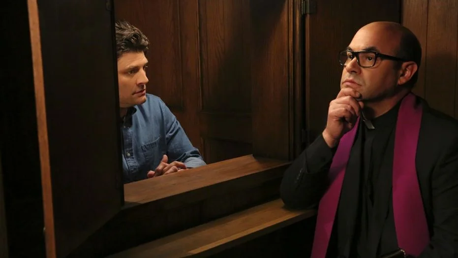 Chip seeks assistance on his spiritual journey from Father Gene, a Catholic priest (Ian Gomez). © CBS Studios