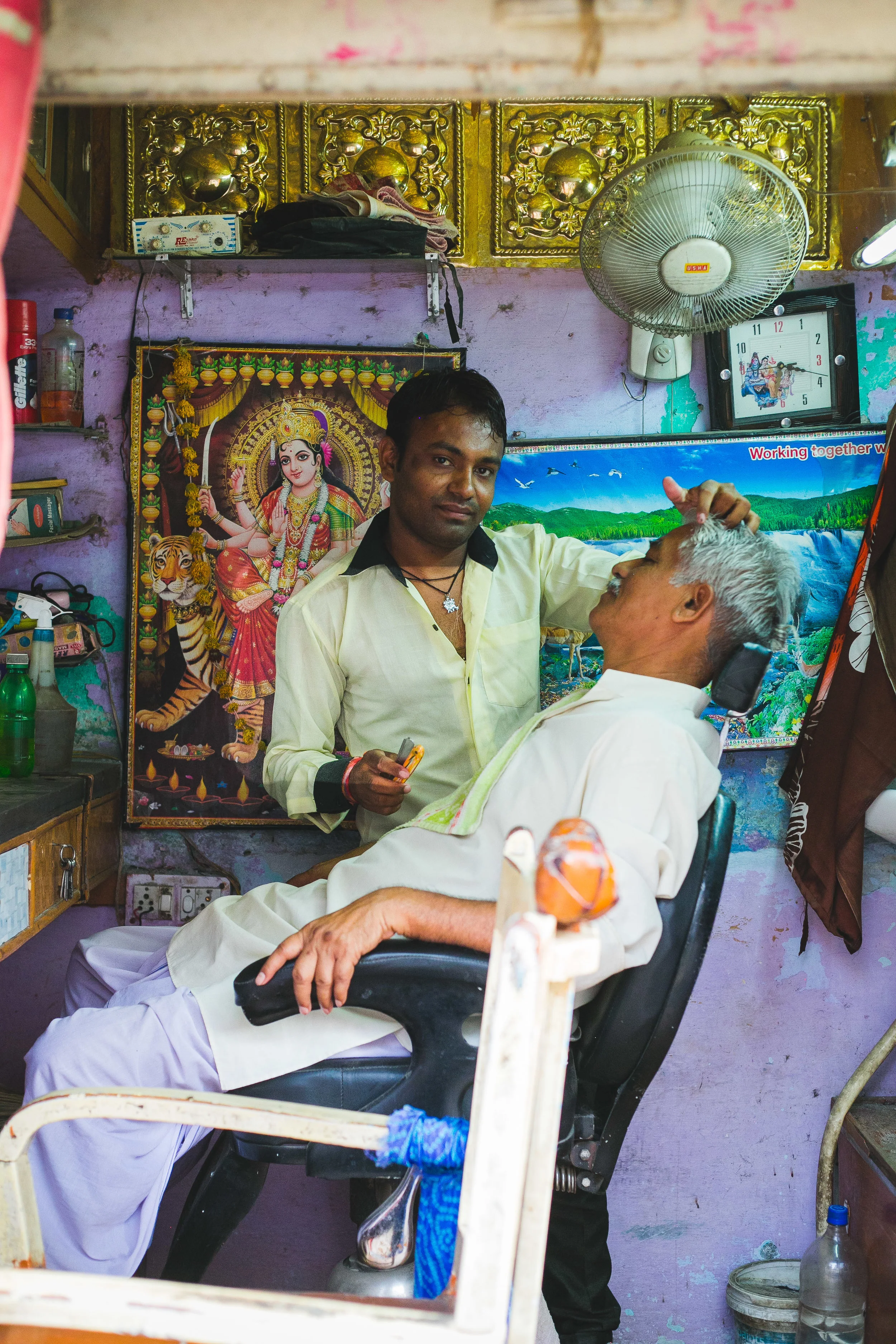 a man and his salon. no one is more of a companion to everyone than the local barber. here in downtown Rajasthan our Barber had a lineup of men waiting to chat and get a clean shave.