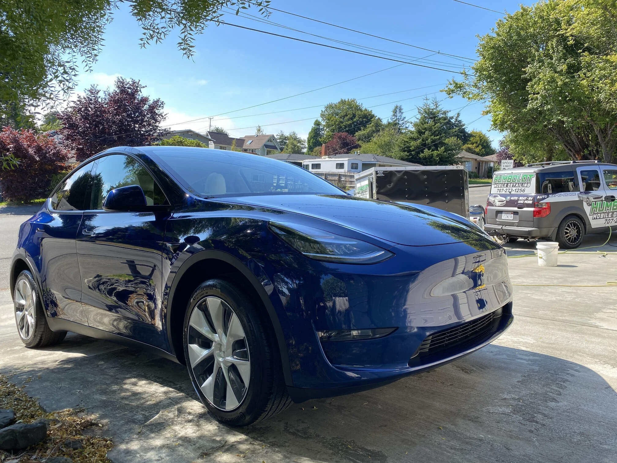 ceramic_coating_tesla_with_business_vehicle_in_back - resized.jpg