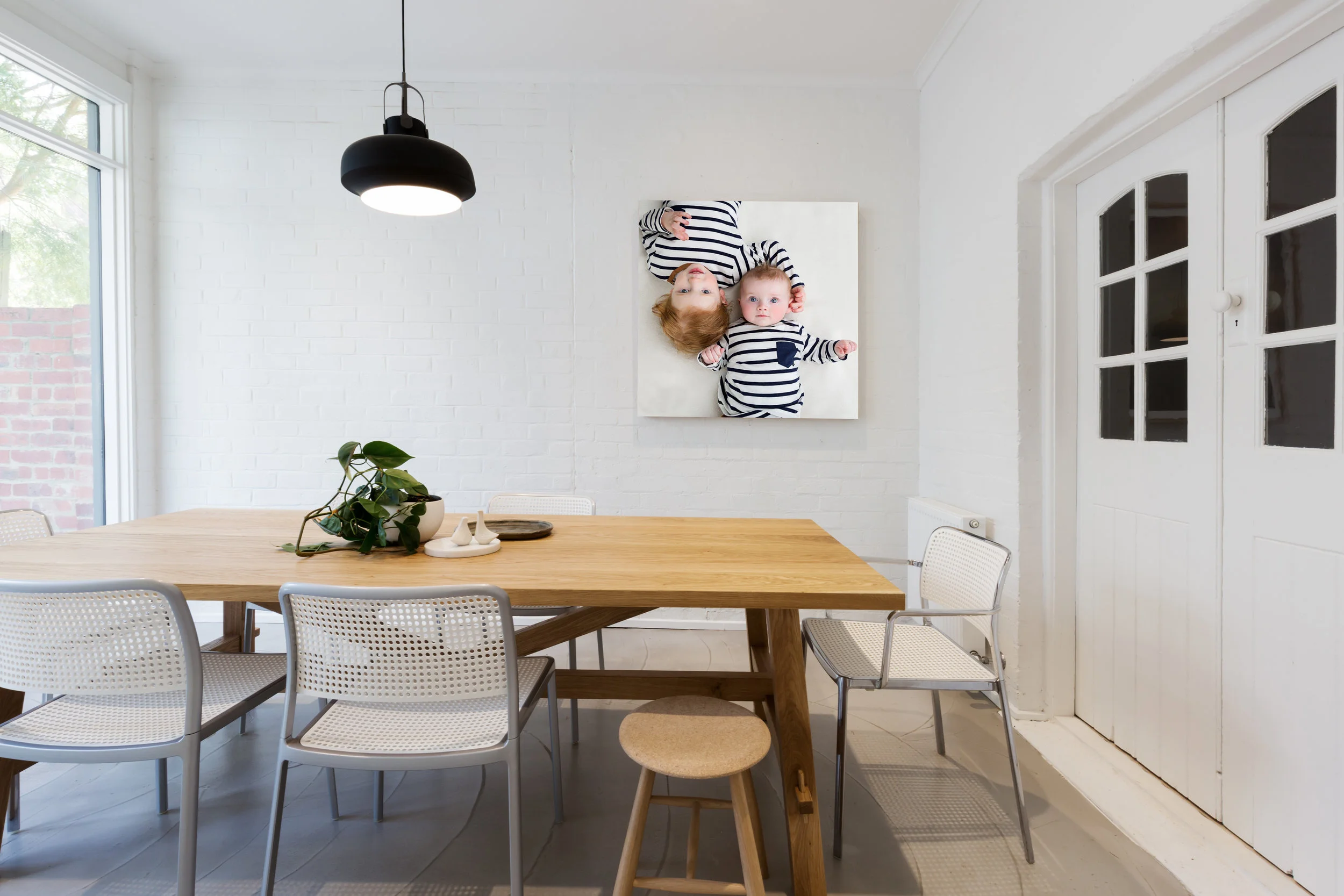 Modern scandinavian styled interior dining room with pendant lig
