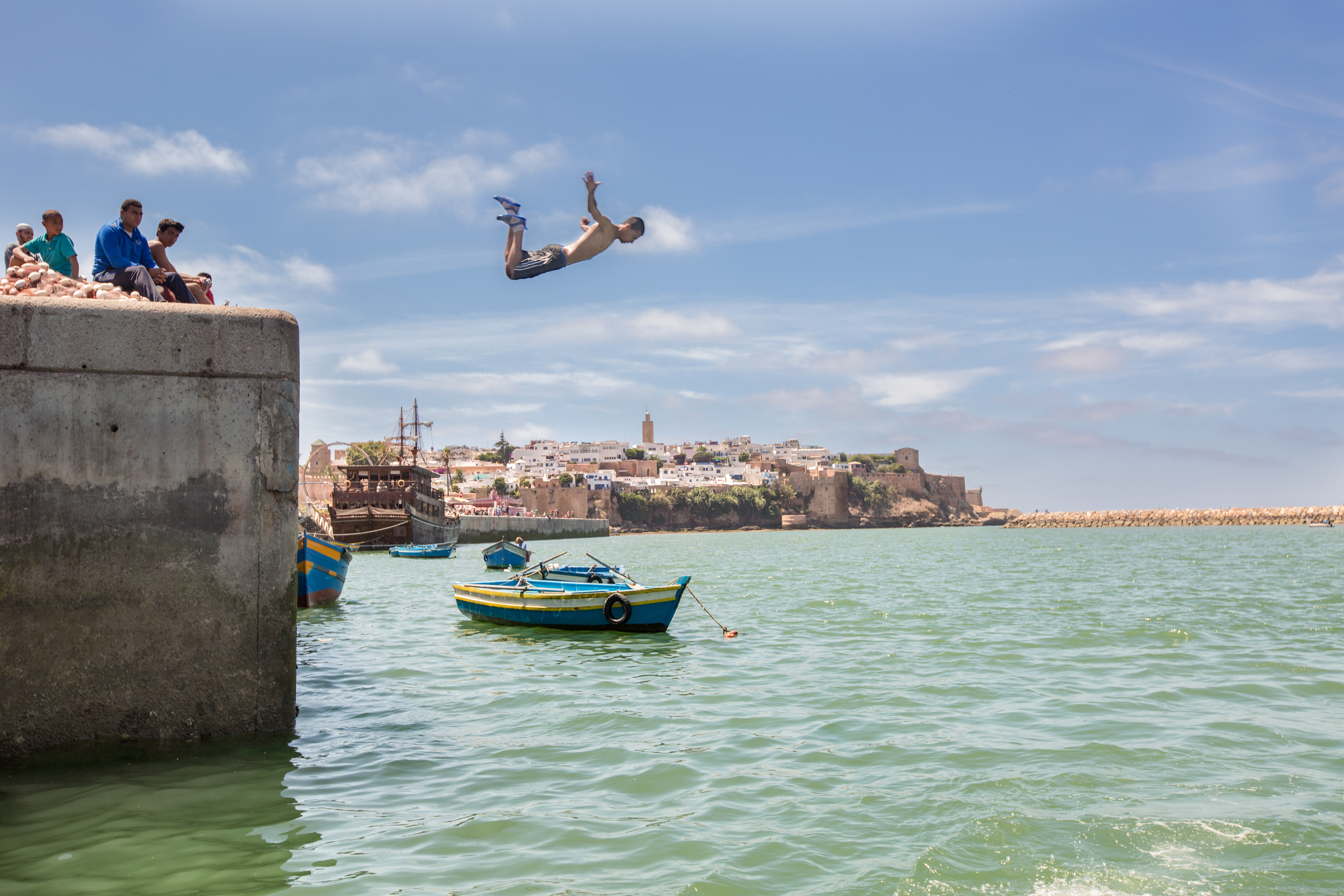 Kid diving over the historic city of Oudayas