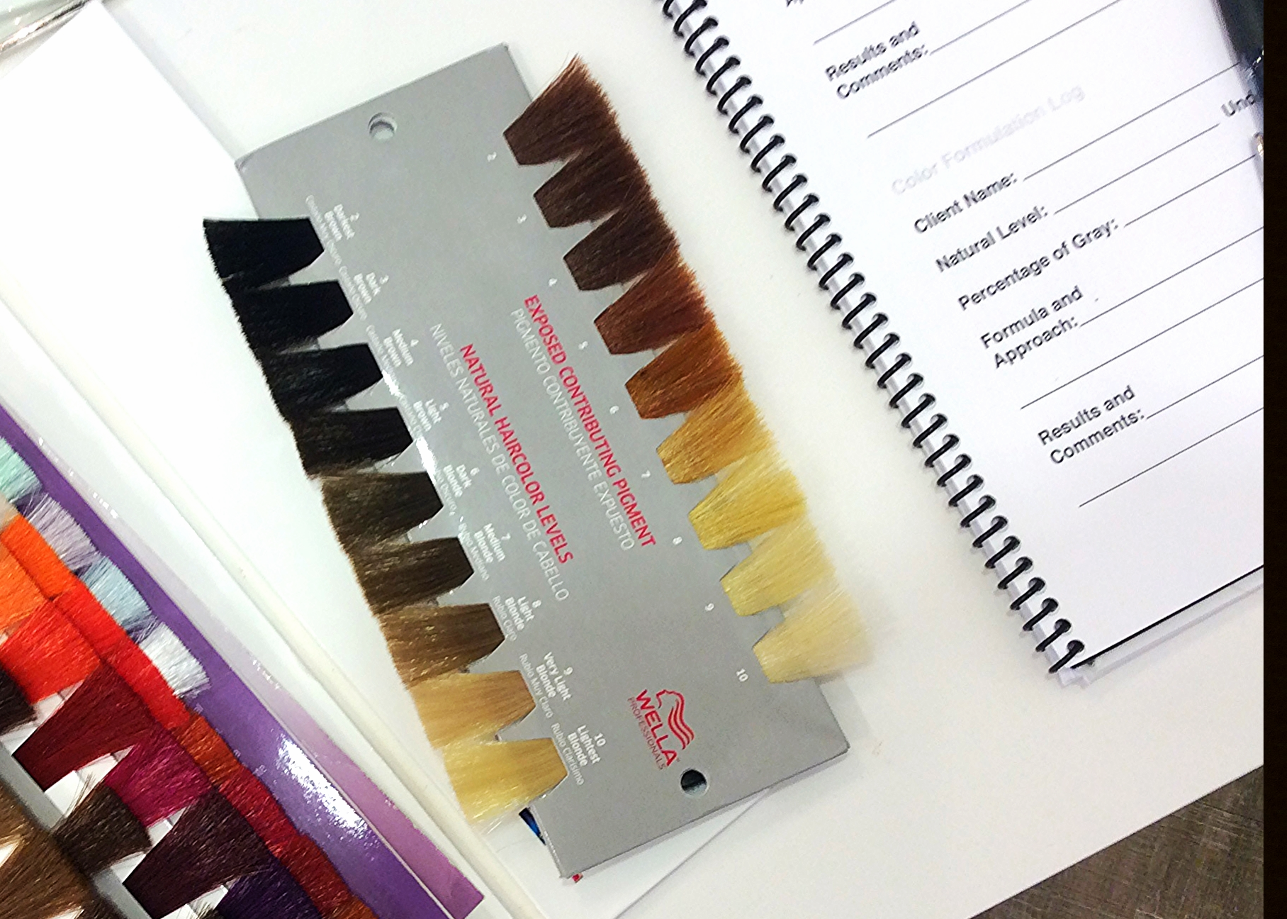 (The colors on the left of this swatch show natural levels of hair. The right is the exposed underlying pigment in hair that each level lifts to. After lightening the natural color to the desired level of lightness, an appropriate toner is used!)