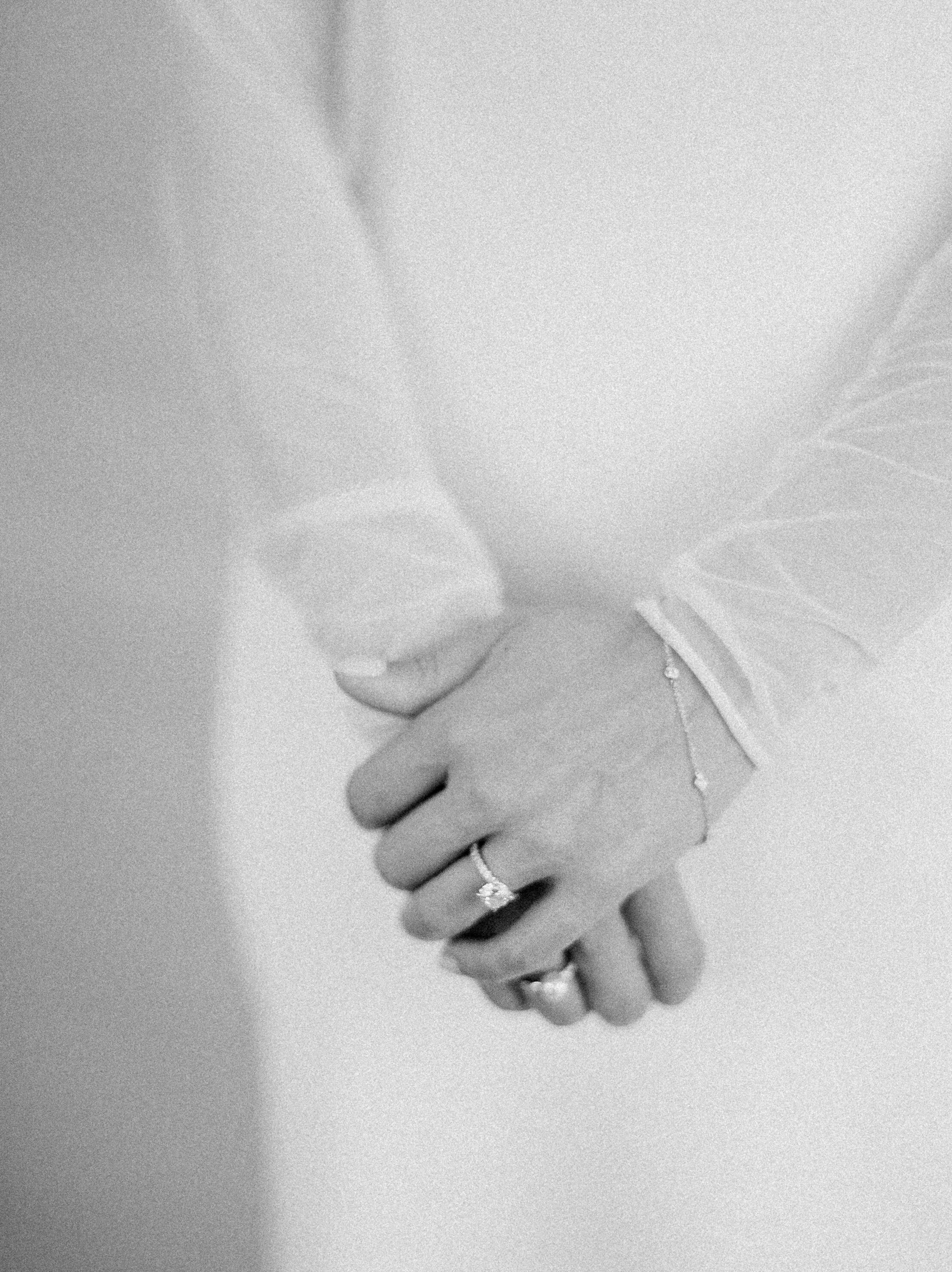 long sleeve wedding dress diamond ring pose