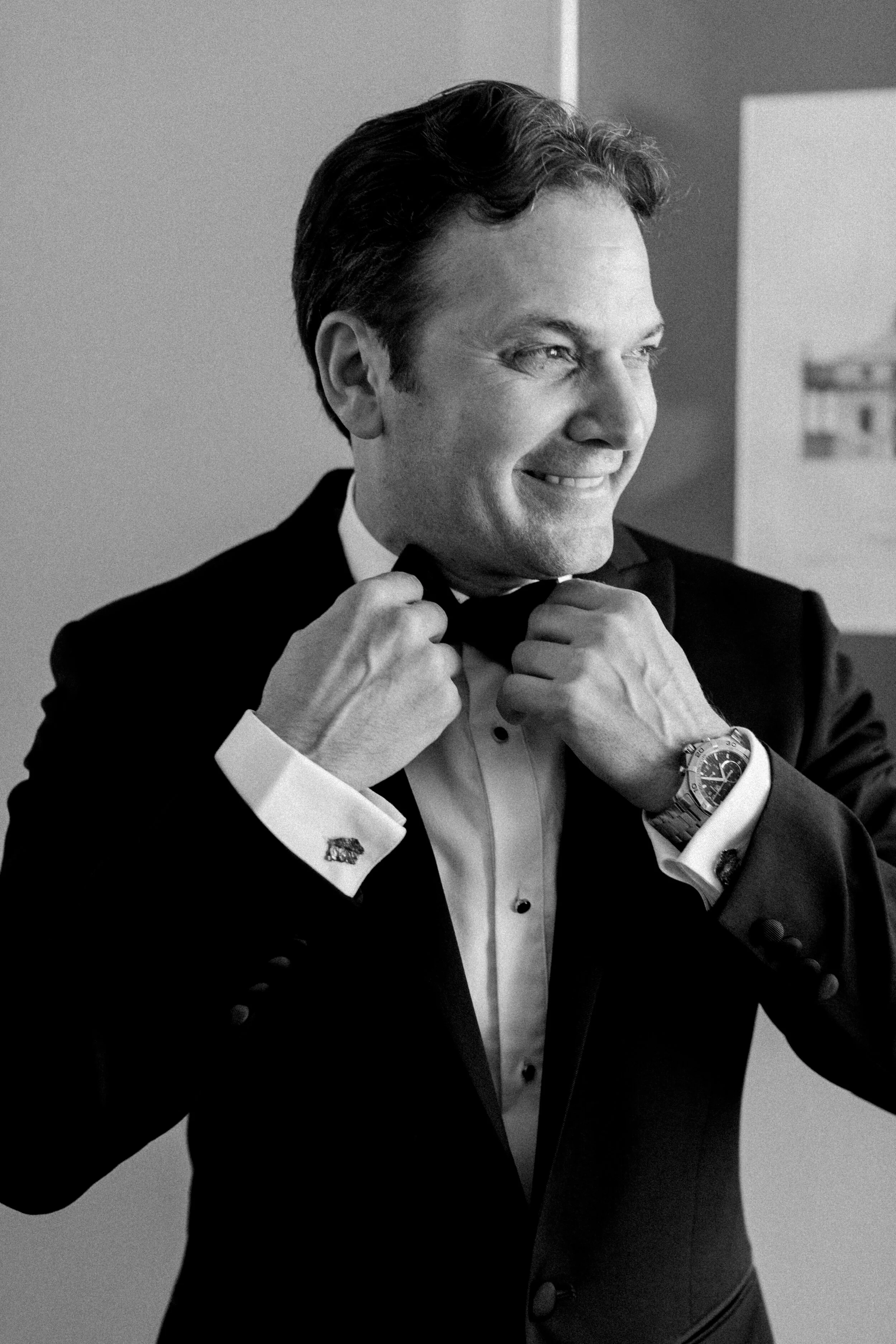 smiling groom bow tie black tuxuedo