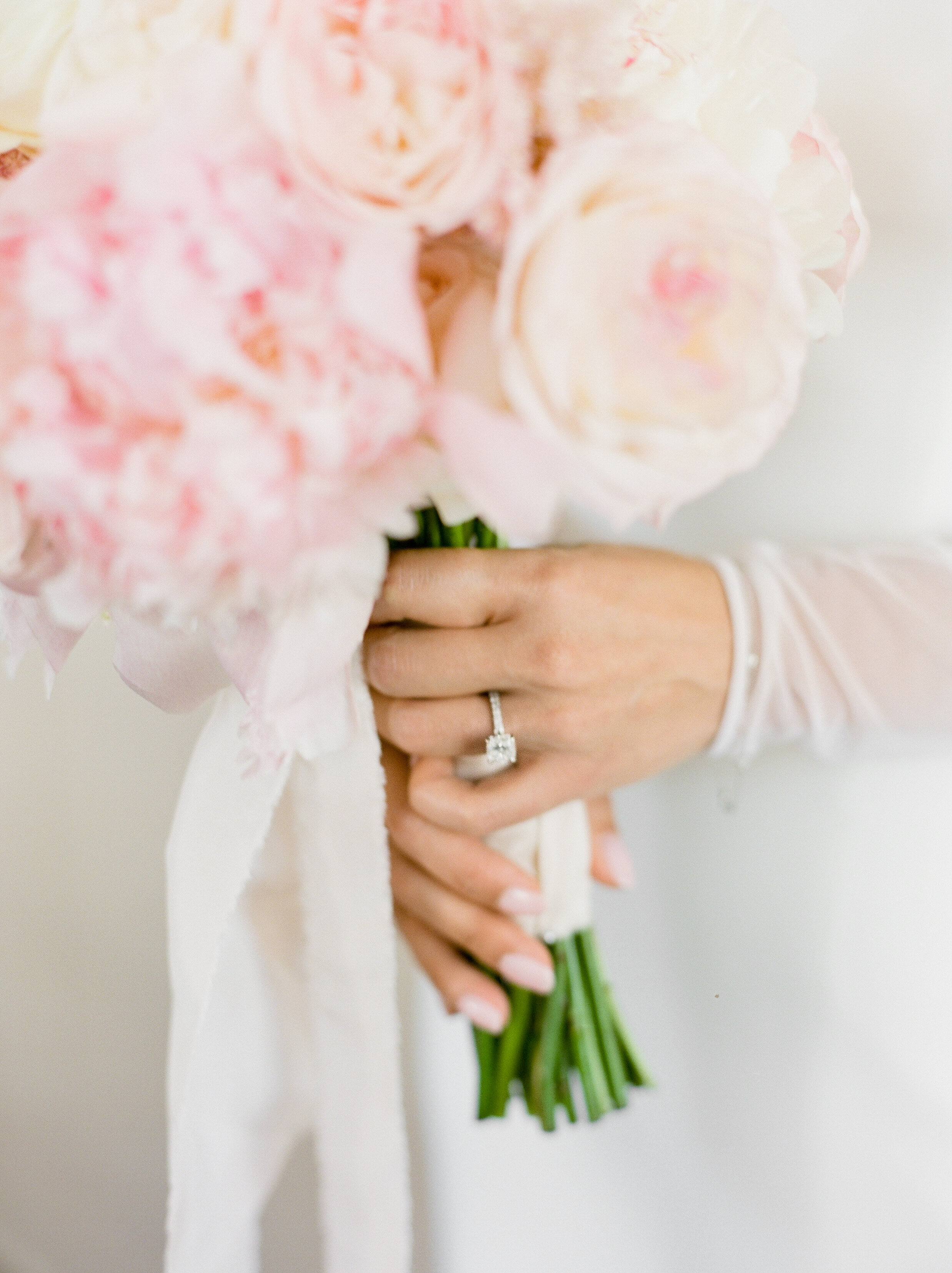 bride pink peony bouquet engagement ring