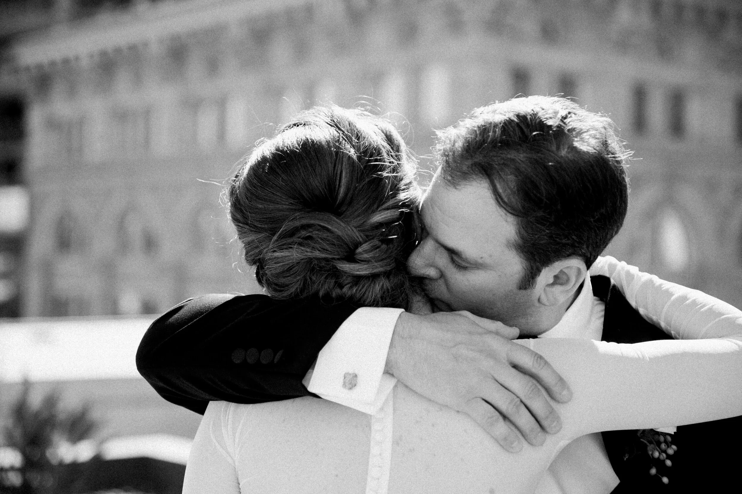 bride and groom embrace kiss san francisco