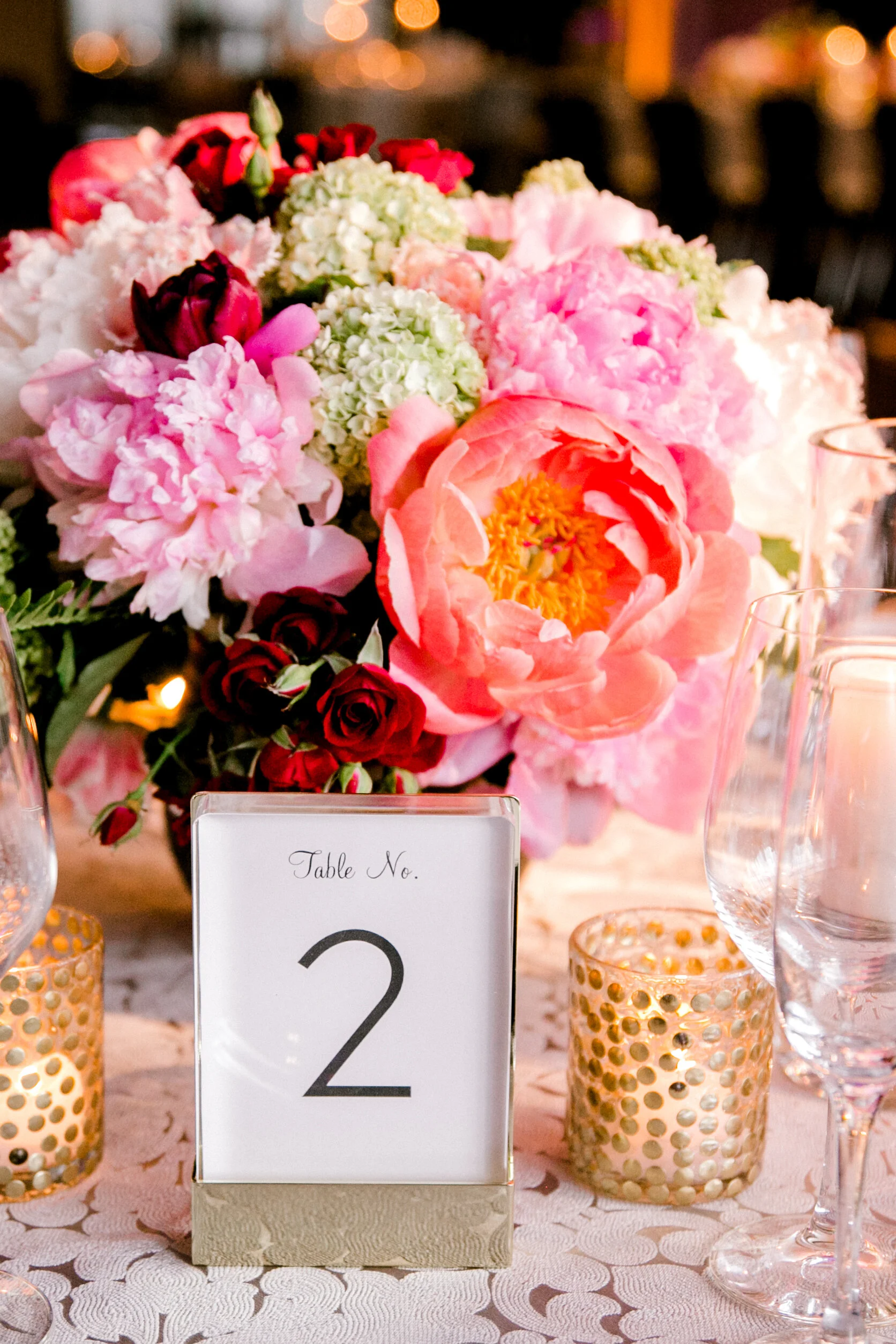 colorful centerpiece gold accents table number coral peony