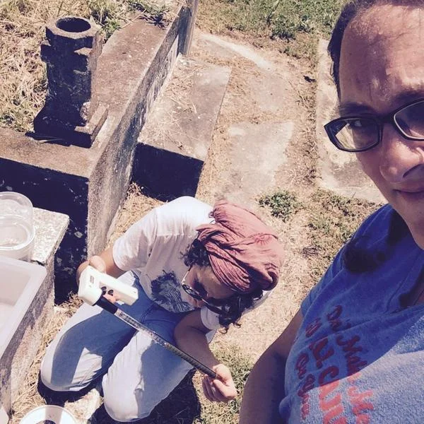 Dr. RC Christofferson looking for mosquitoes in a graveyard with her graduate student Interact with her on Twitter @RC_Epi