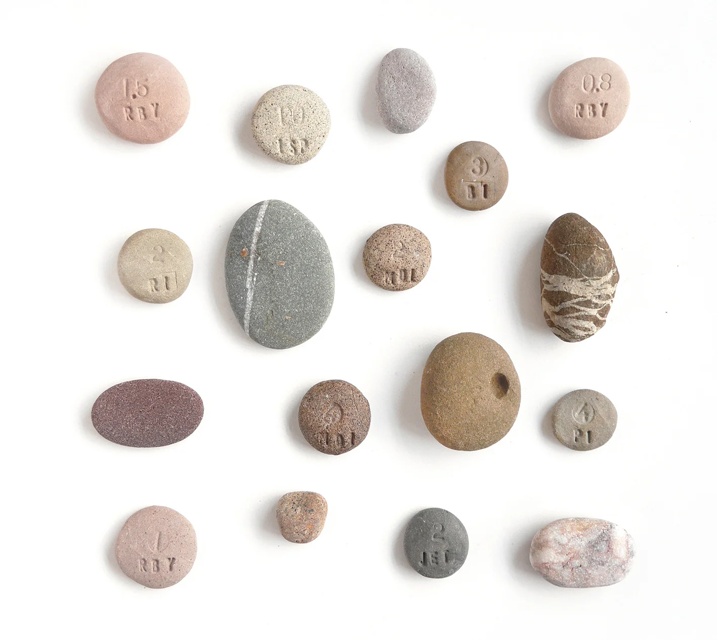 Collected pebbles and a few of my coloured clay body tests for rock and pebble pots
