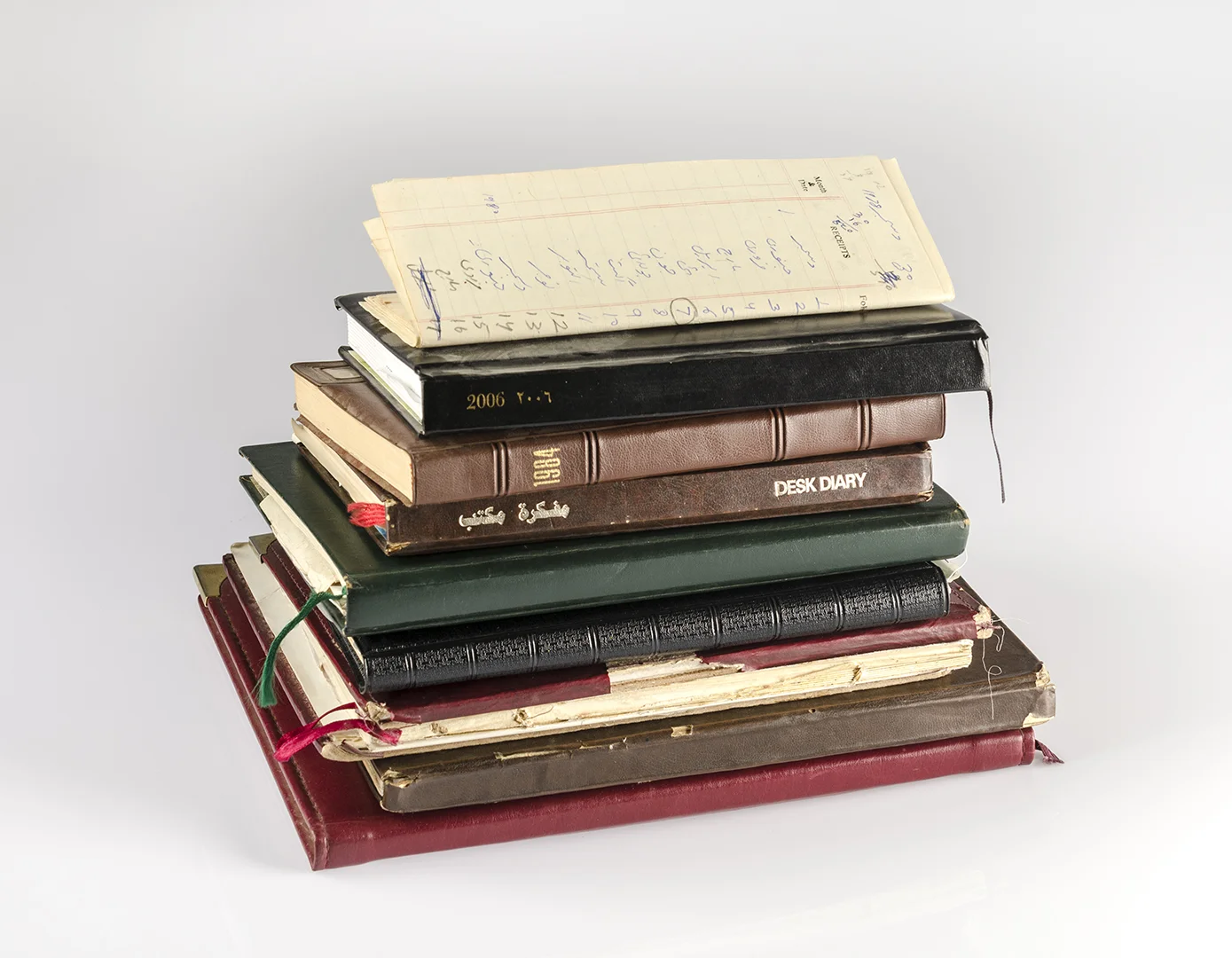 Her ledgers and diaries since 1970 in which she has kept records of every dime, cent, riyal, dollar and rupee she has received, spent and saved, when, where, how and on whom (Contents of her wardrobe series), 2016, Pure pigment print on Platine Rag paper, 35.5 x 45.75 cm