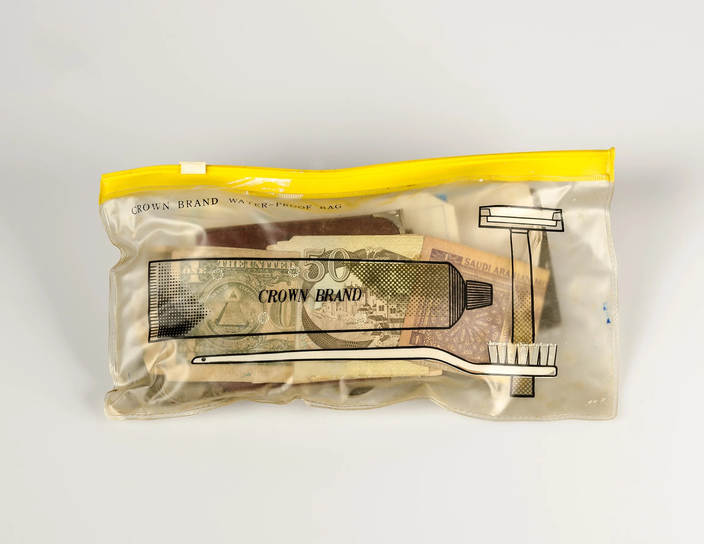 Her husband’s travel toiletry satchel where she now keeps old mementoes including old currency banknotes (Contents of her wardrobe series), 2016, Pure pigment print on Platine Rag paper, 35.5 x 45.75 cm