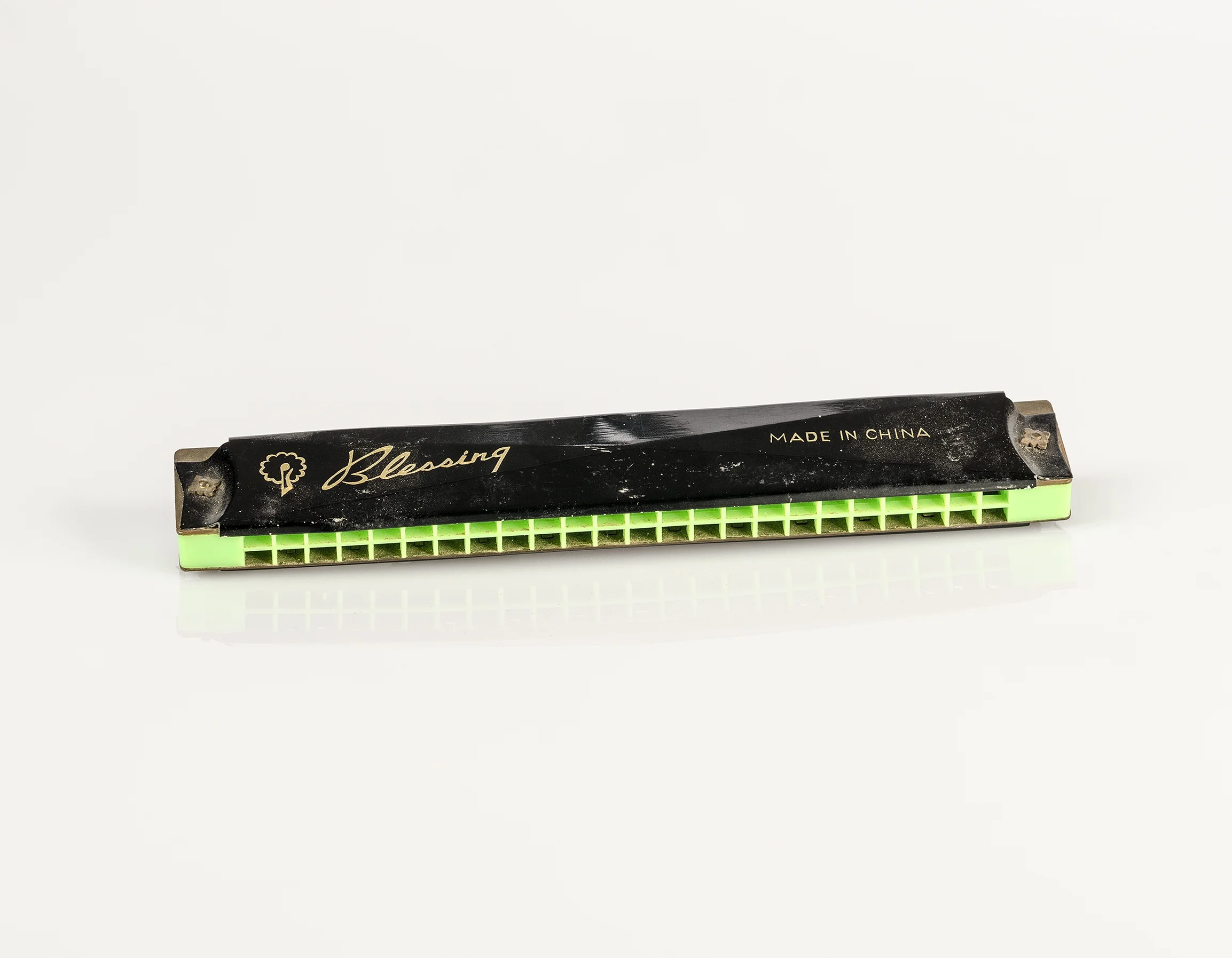 She keeps my childhood vintage ‘Blessing’ Harmonica Mouth Organ that is a gift from my father (Contents of her bedside drawer series), 2016, Pure pigment print on Platine Rag paper, 35.5 x 45.75 cm
