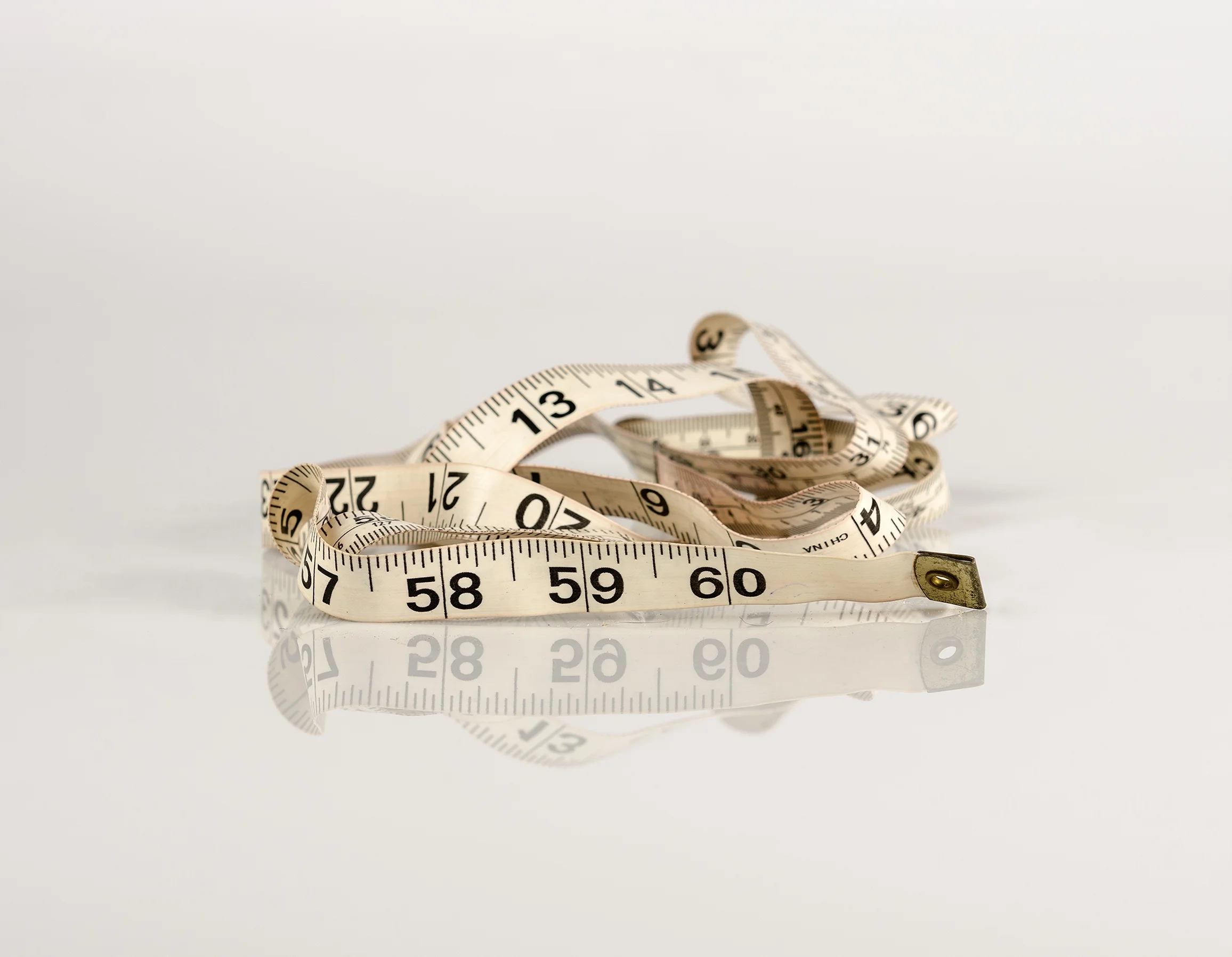 Her old plastic sewing tape measure (Contents of her bedside drawer series) (2016), Pure pigment print on Platine Rag paper, 35.5 x 45.75 cm
