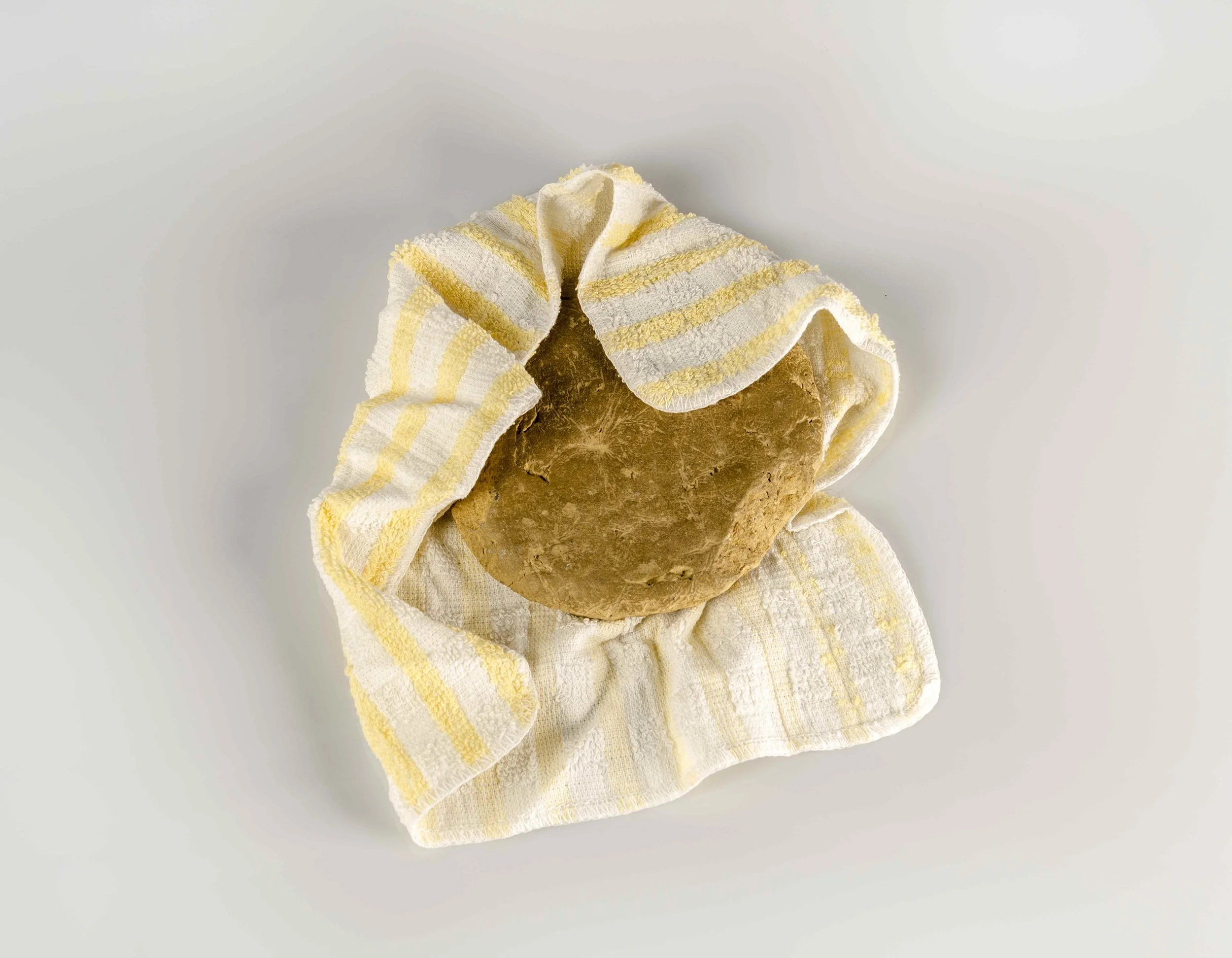 Her mother’s round clay tablet for Tayammum (dry ablution for prayers) that she is now using in her memory (Contents of her bedside drawer series), 2016, Pure pigment print on Platine Rag paper, 35.5 x 45.75 cm