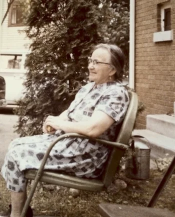 the author's grandmother sitting in her yard