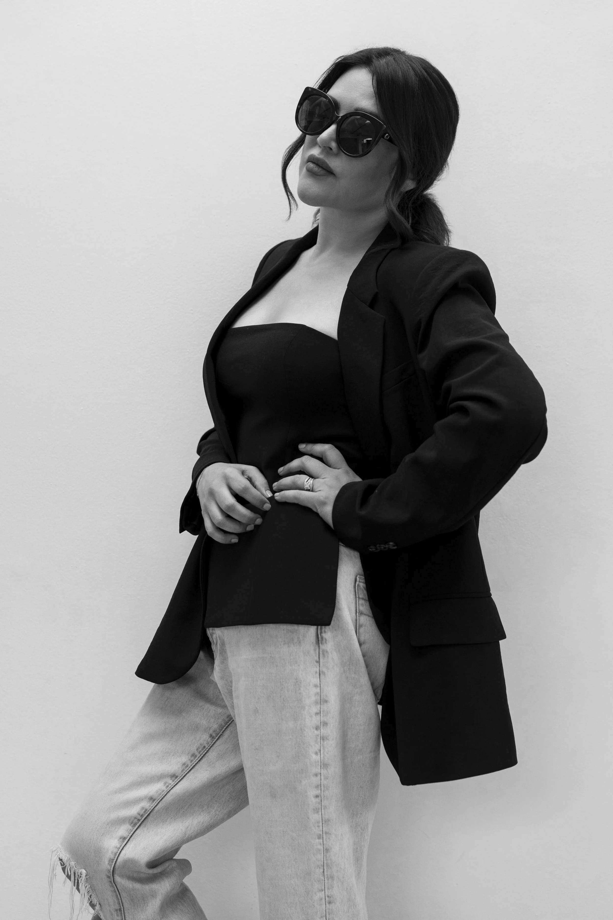 black and white headshot of women in sunglasses