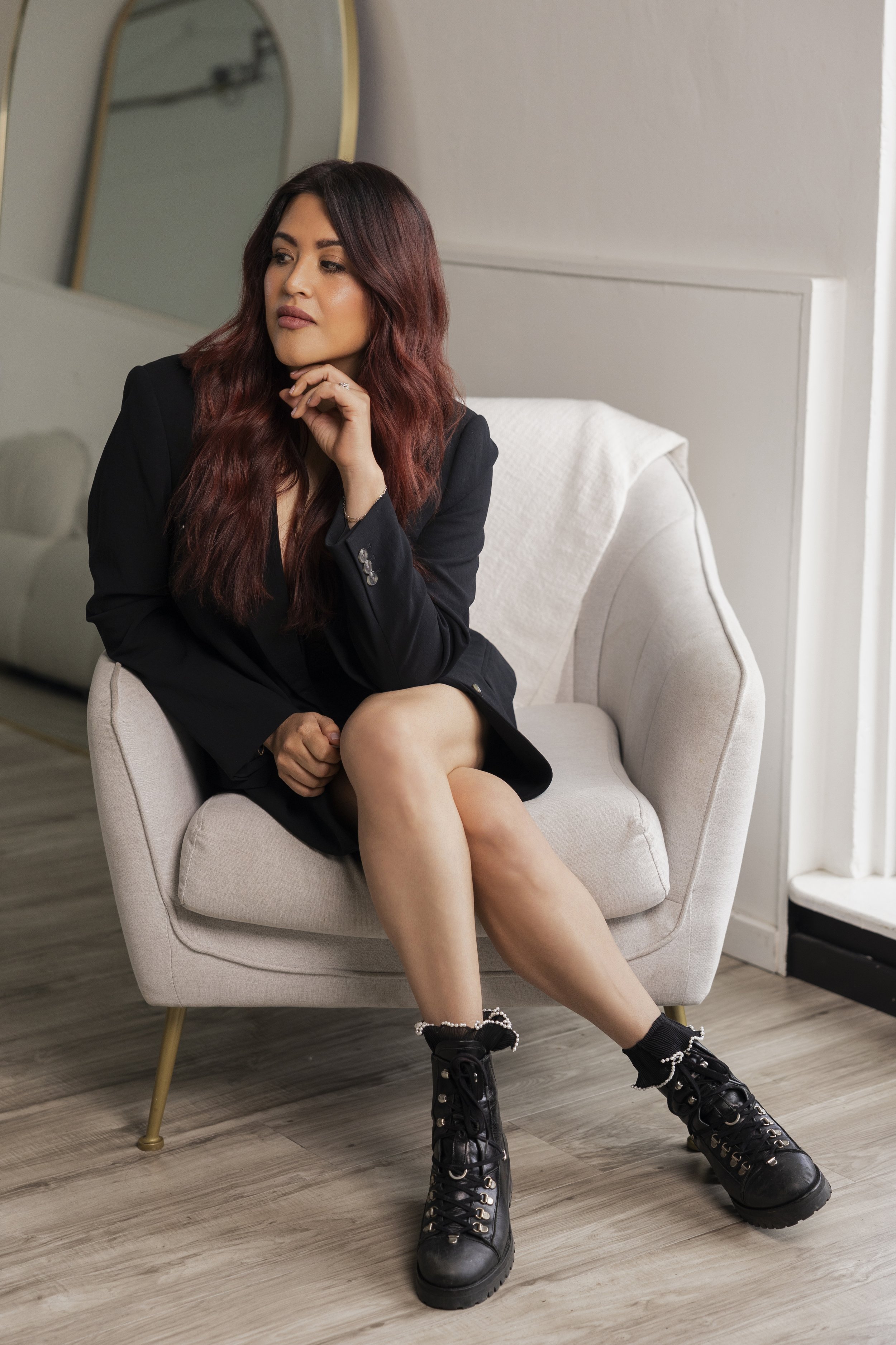 Michelle Wight Seattle Makeup Artist sitting on chair in a studio