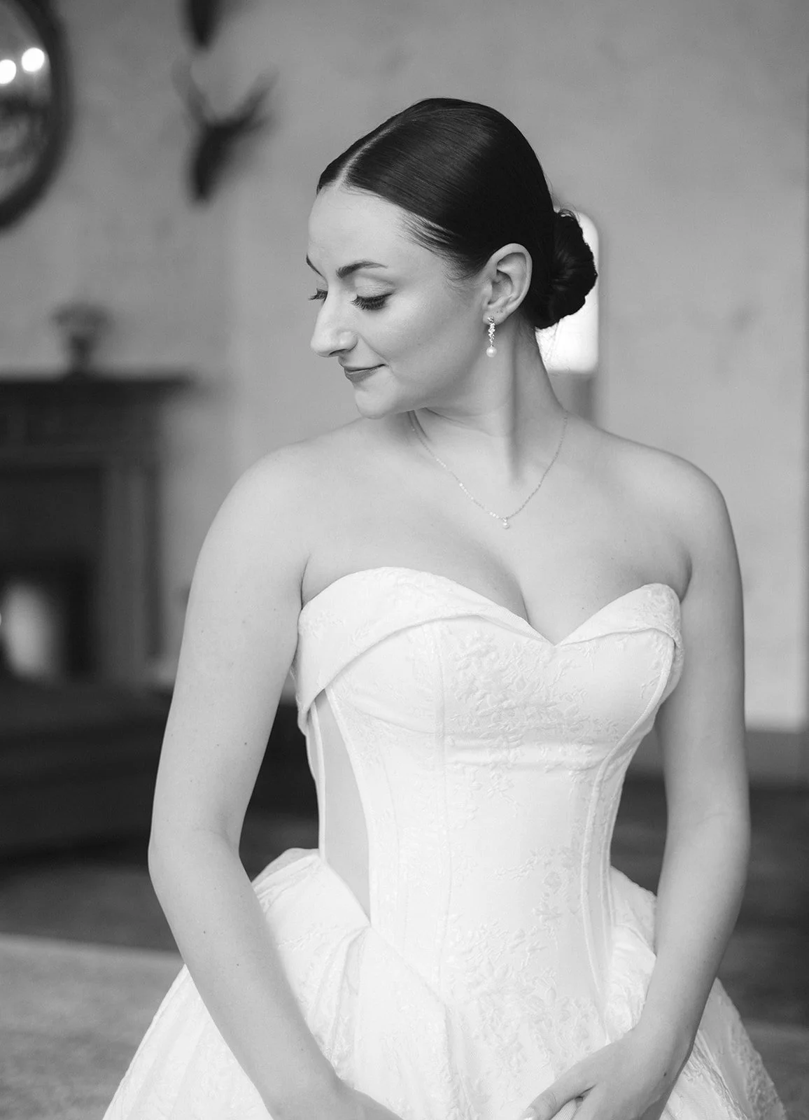 bride in strapless gown and low bun downtown seattle