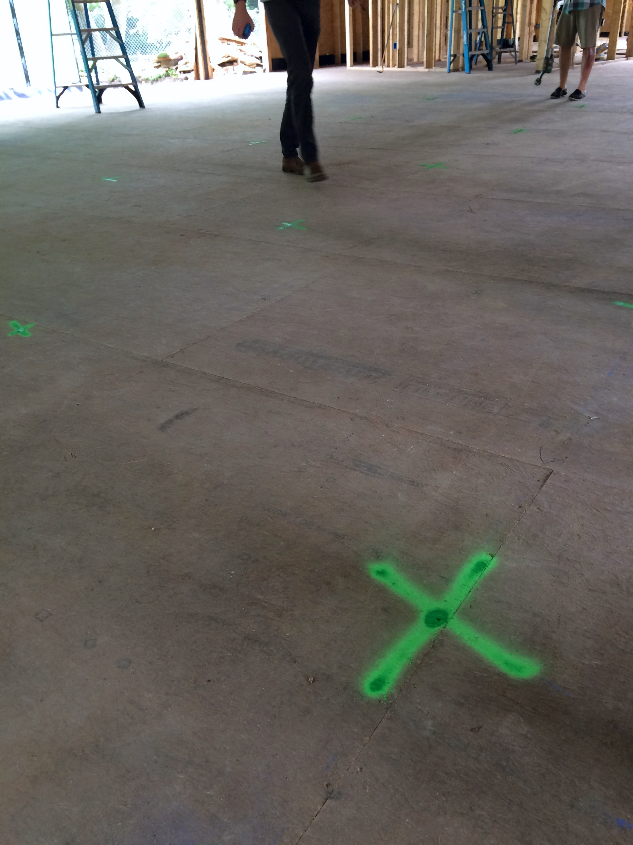 Robert and our talented architect mapped out the lighting plot using a grid (an a can on spray paint) on the floor.