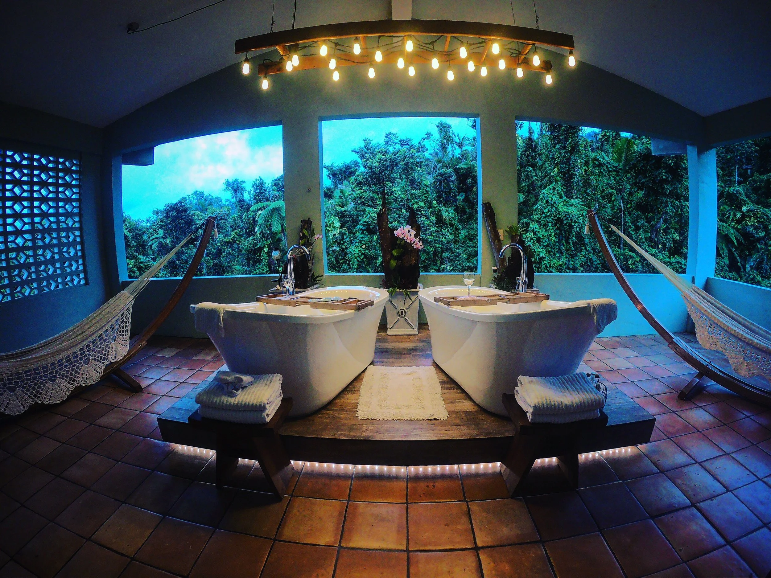 Jungle suite porch overlooks the El Yunque rainforest of Puerto Rico. This isn’t “glamping;” you’re invited to a luxurious boutique bed and breakfast stay.