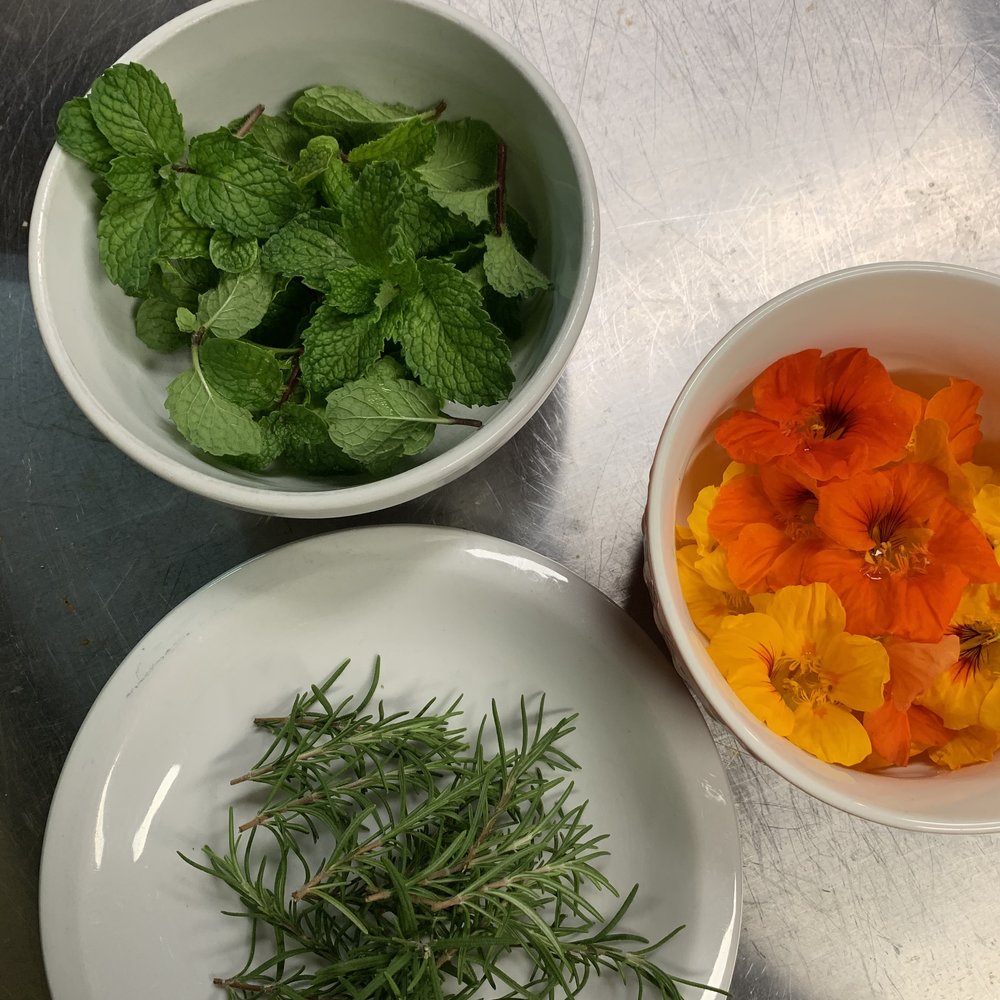  Mint for the water, rosemary for the potatoes, and edible flowers for dessert. And they all came right off the Inn’s property! 