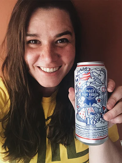 Kelly Ward holding a PBR by Kelly Ward