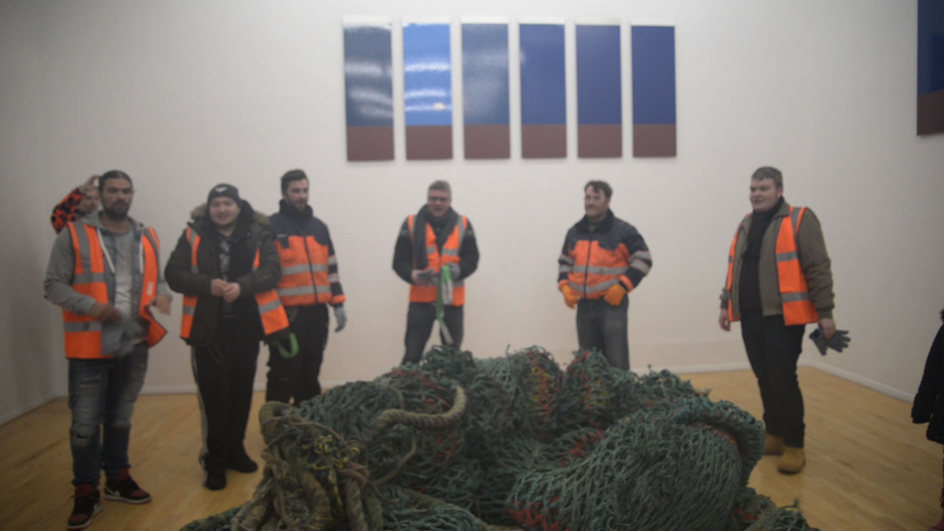 Still from video documentation of dock worker performance.