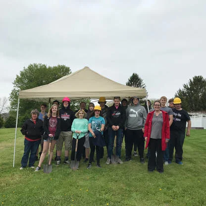 Spring Grove High School students and Habitat for Humanity Ex. Director Kahya Fox at the ground-breaking for the SGHH, May 17, 2019.